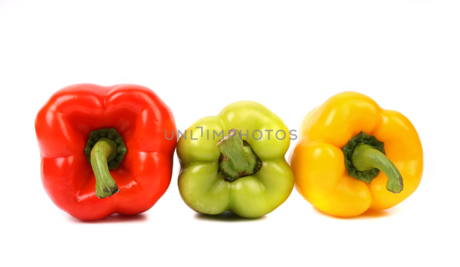 Three colored peppers isolated on a white background