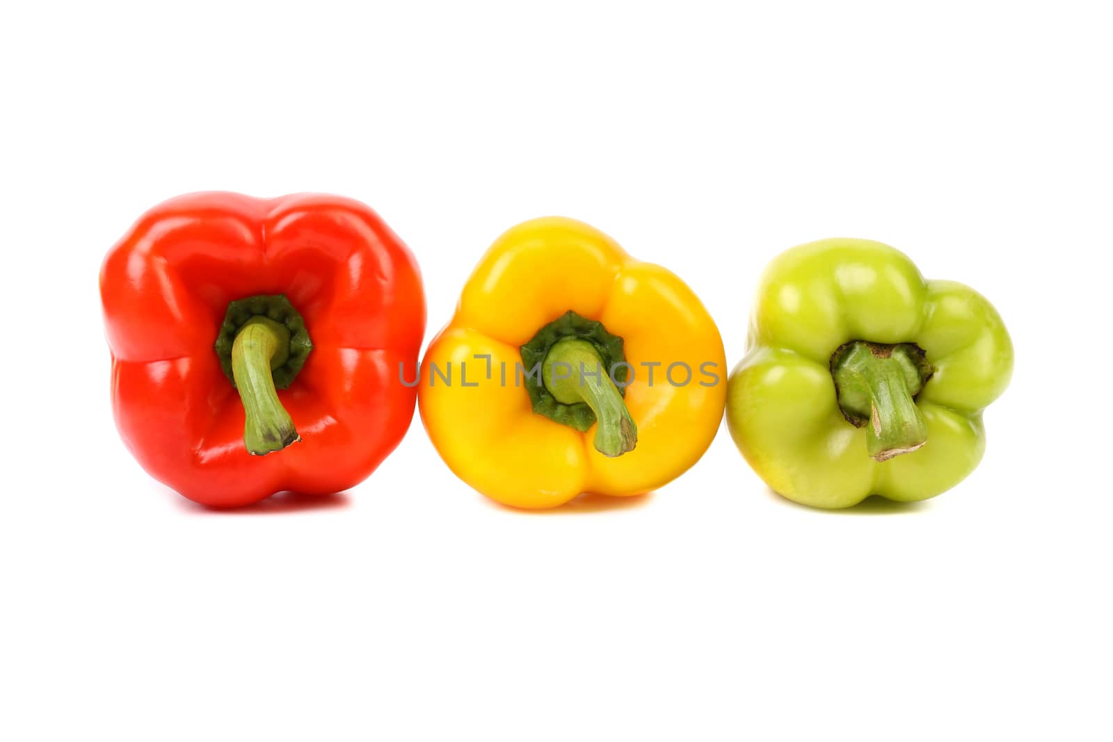 Three colored peppers isolated on a white background