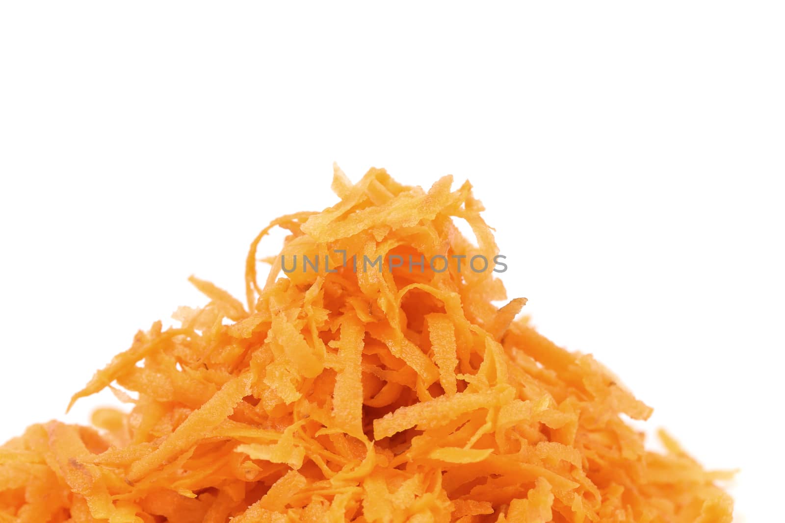 Heap of grated carrots isolated on a white background