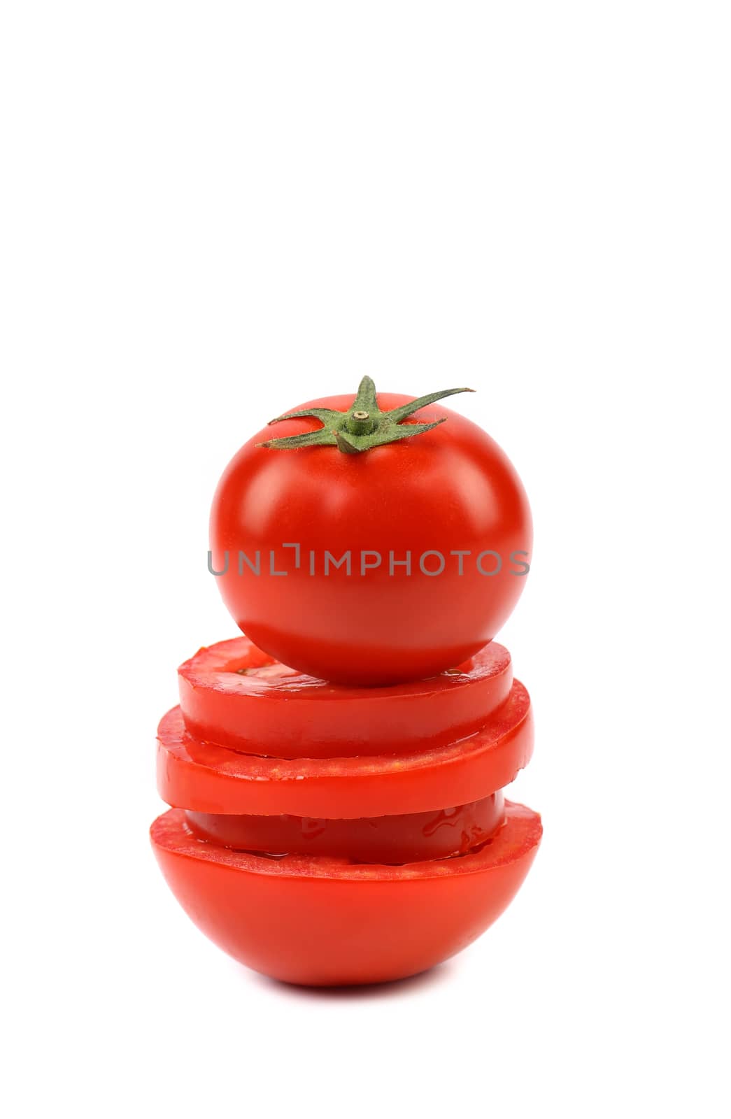 Tomato is located on stack of slices. White background.