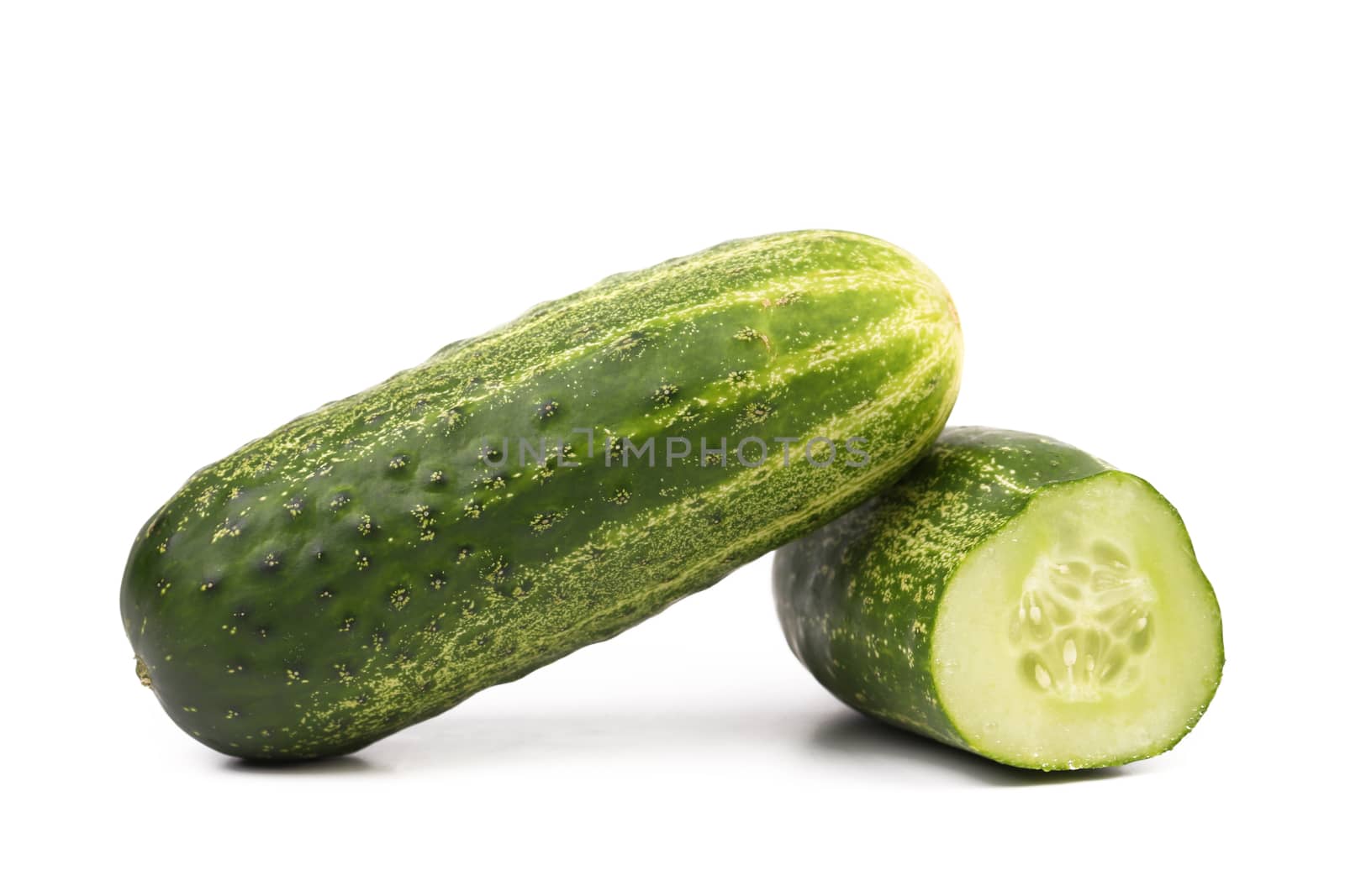 Split of cucumber isolated on a white background..