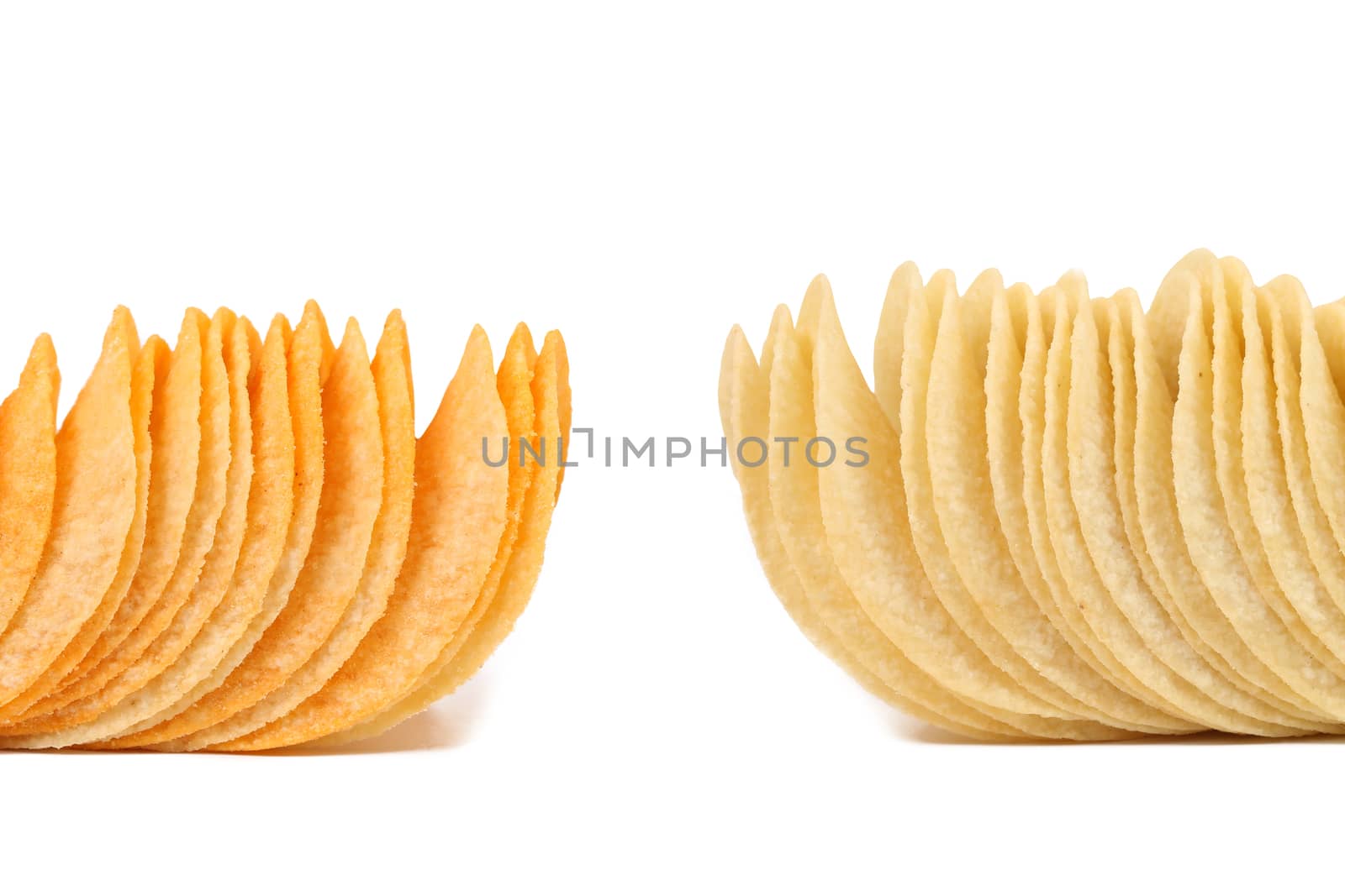 Potato chips. Dark and light. Frame. White background.