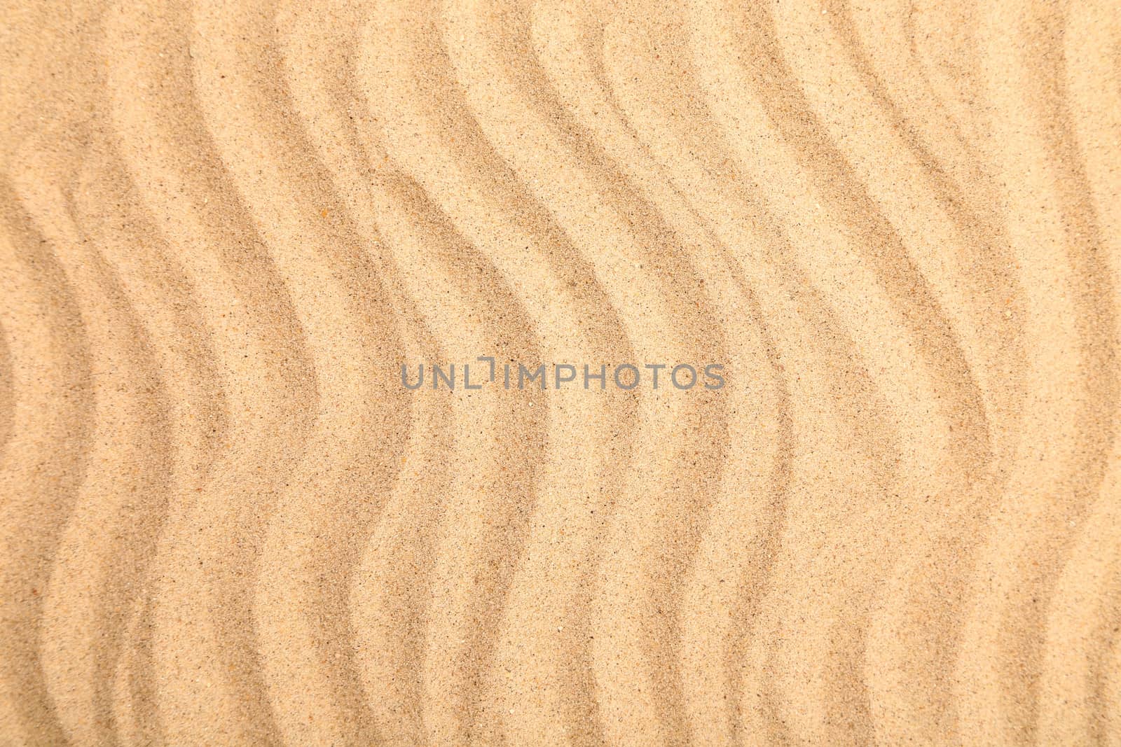 Seamless sand on a whole background. Texture.