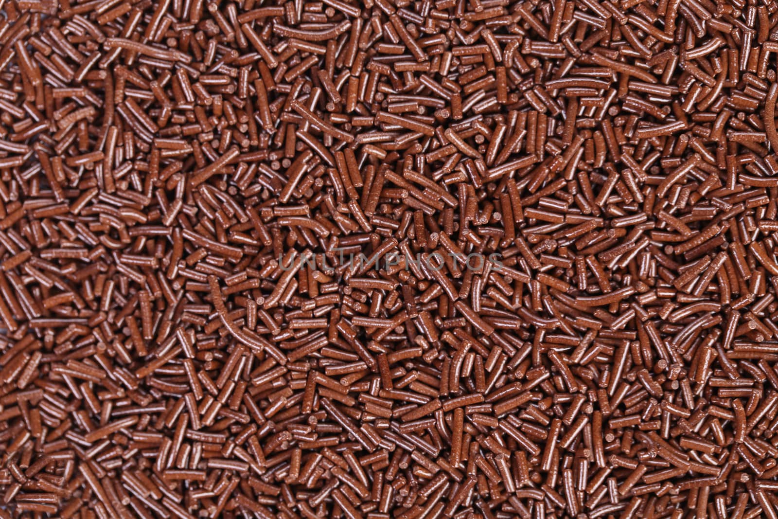 Background texture of chocolate sprinkles. Whole background.