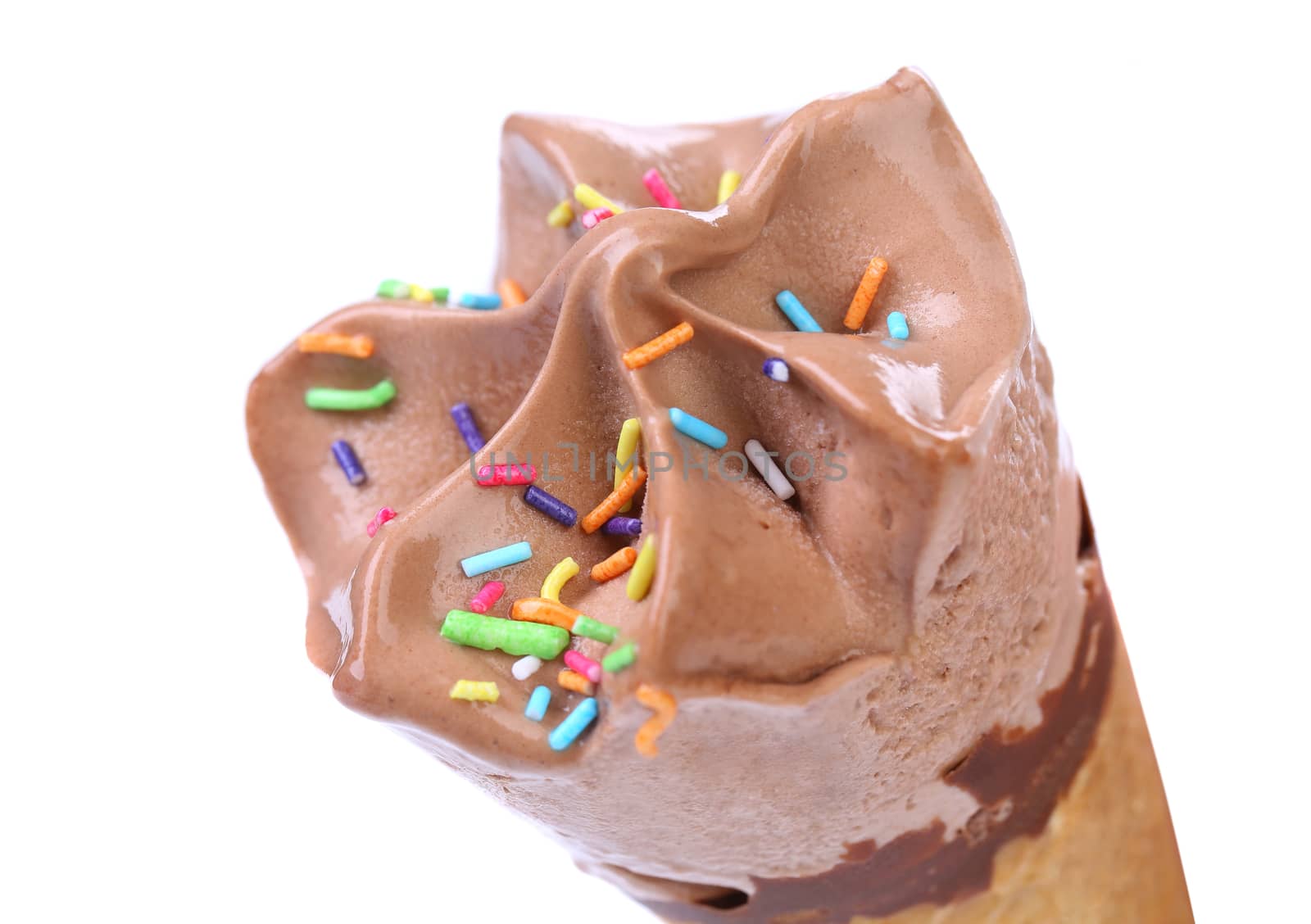 Chocolate ice cream cone. Sprinkles. White background.