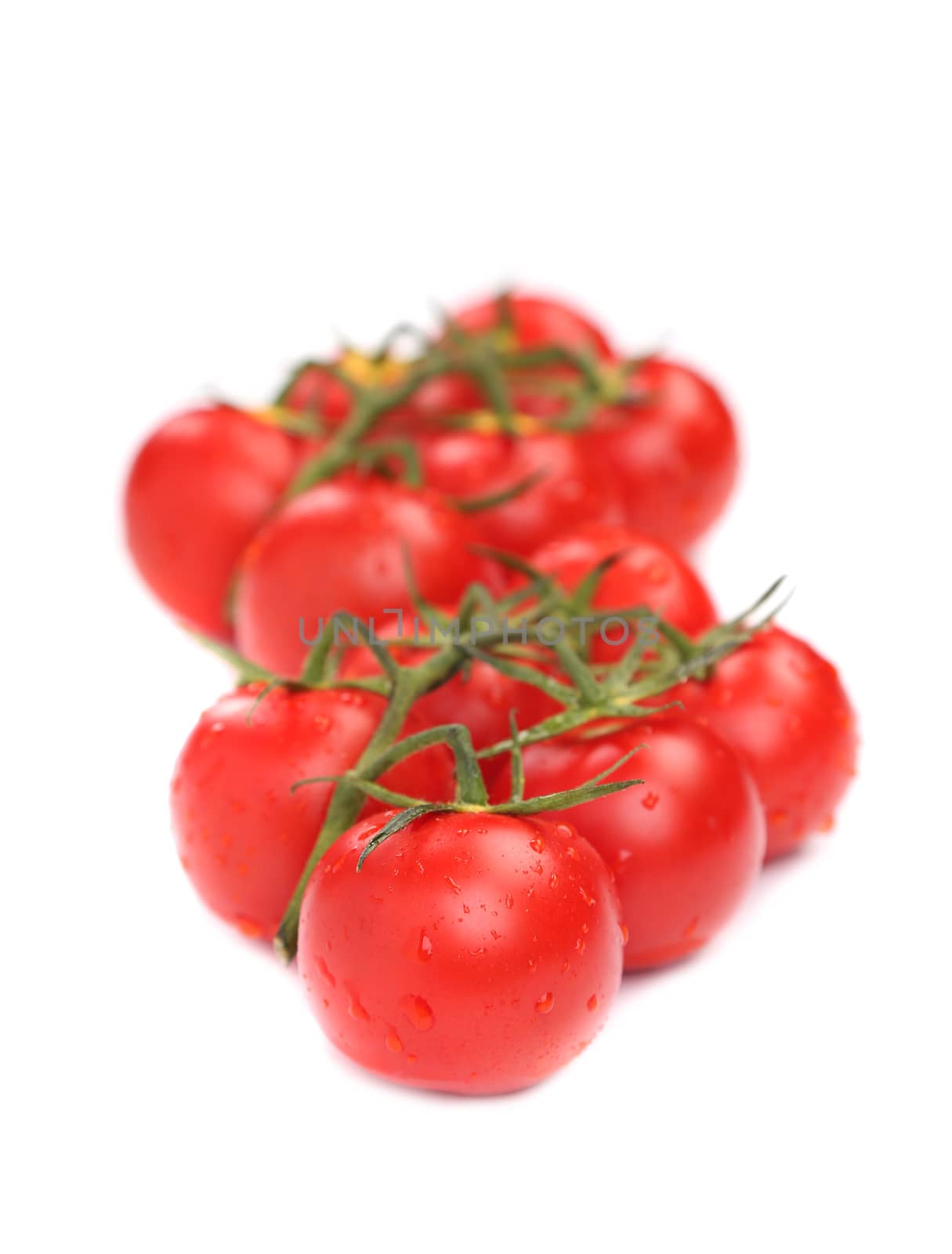 Juicy organic Cherry tomatoes isolated over white background