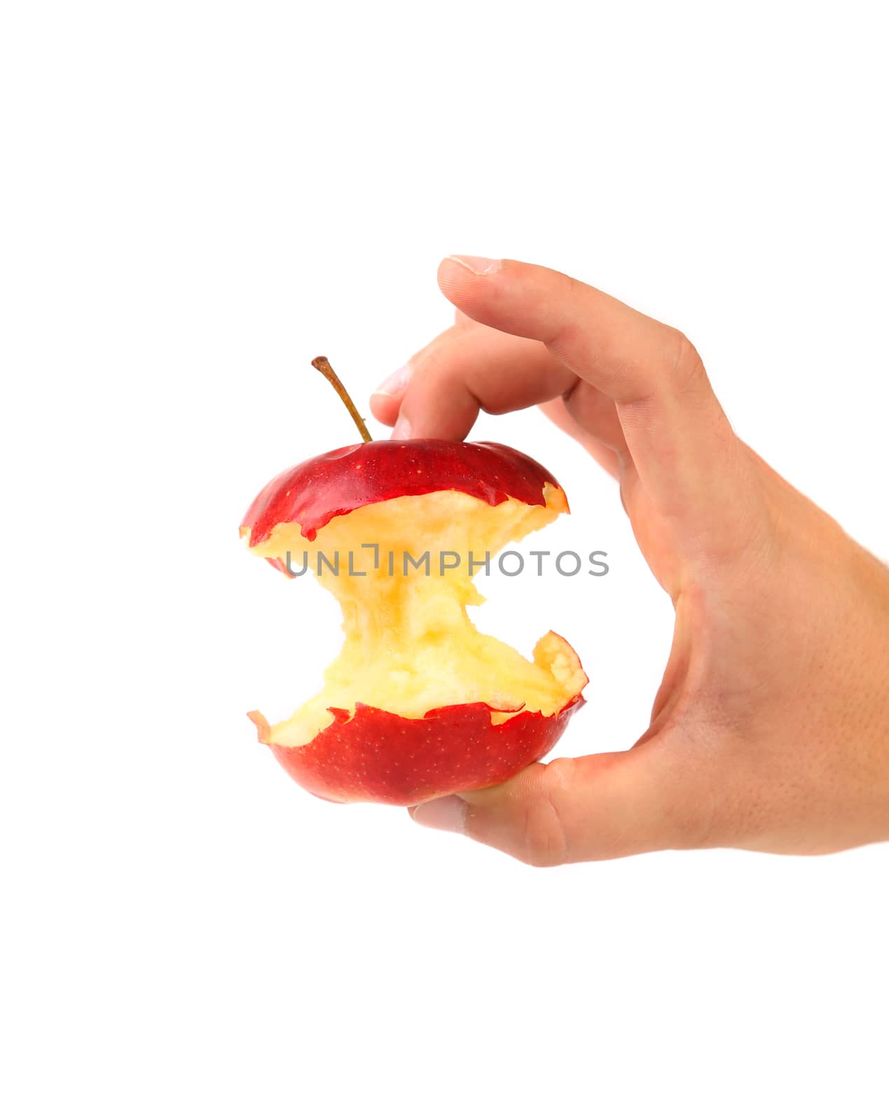Hand holds core of an apple. White background.