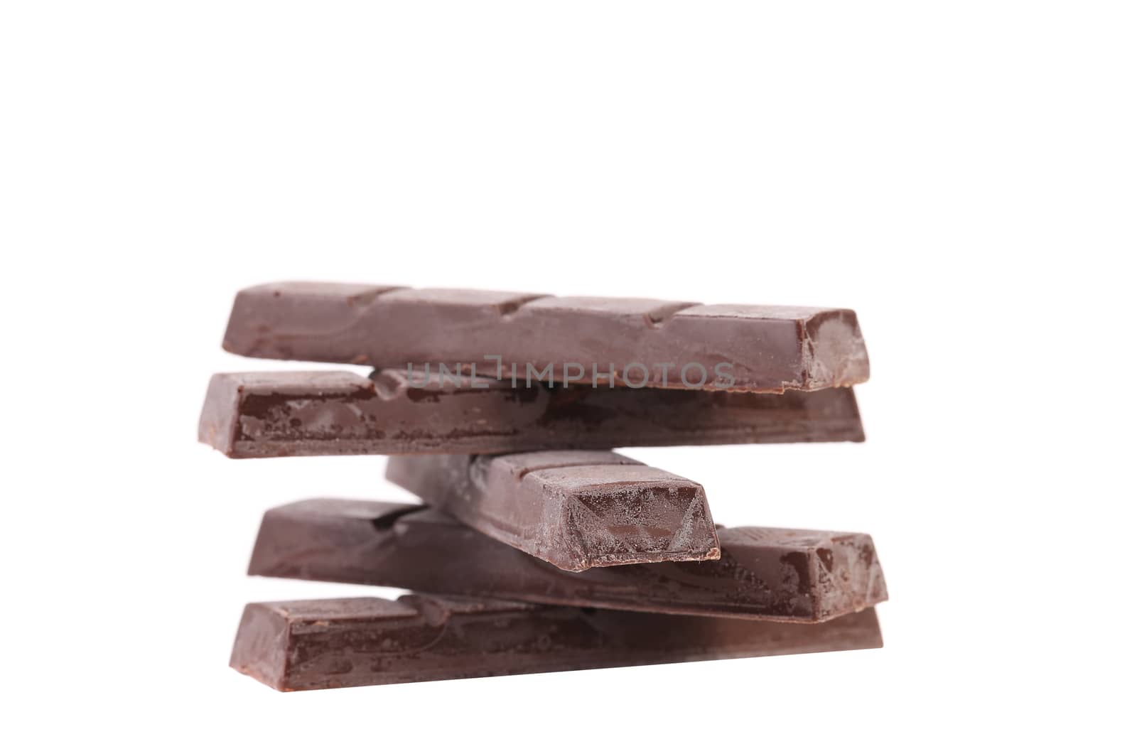 Stack of cooled chocolate bars. White background.
