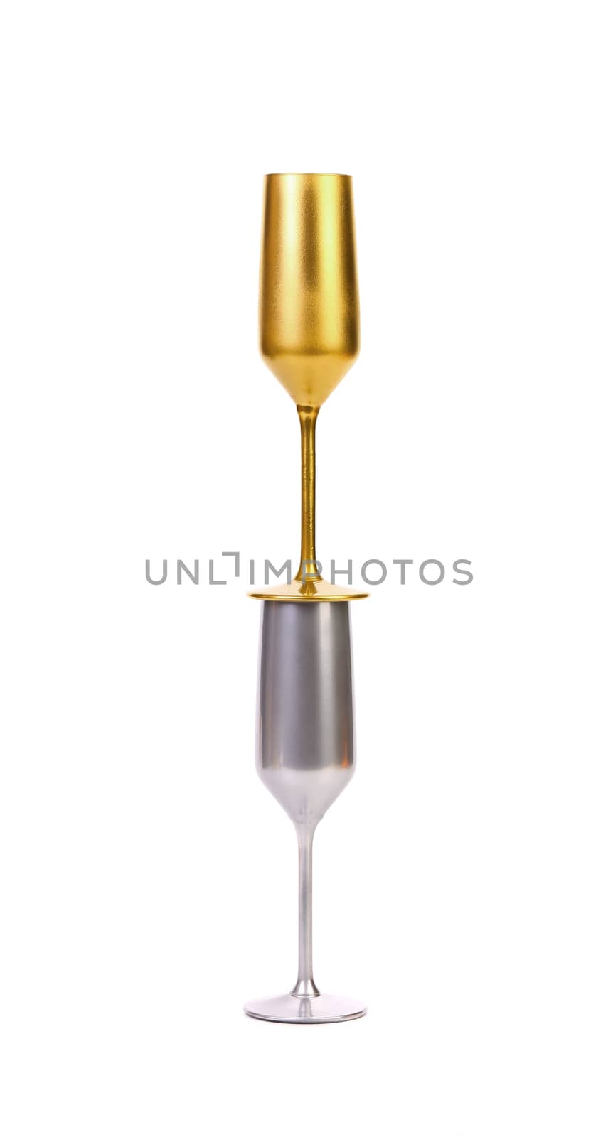 Golden and silver champagne glasses isolated on a white background.