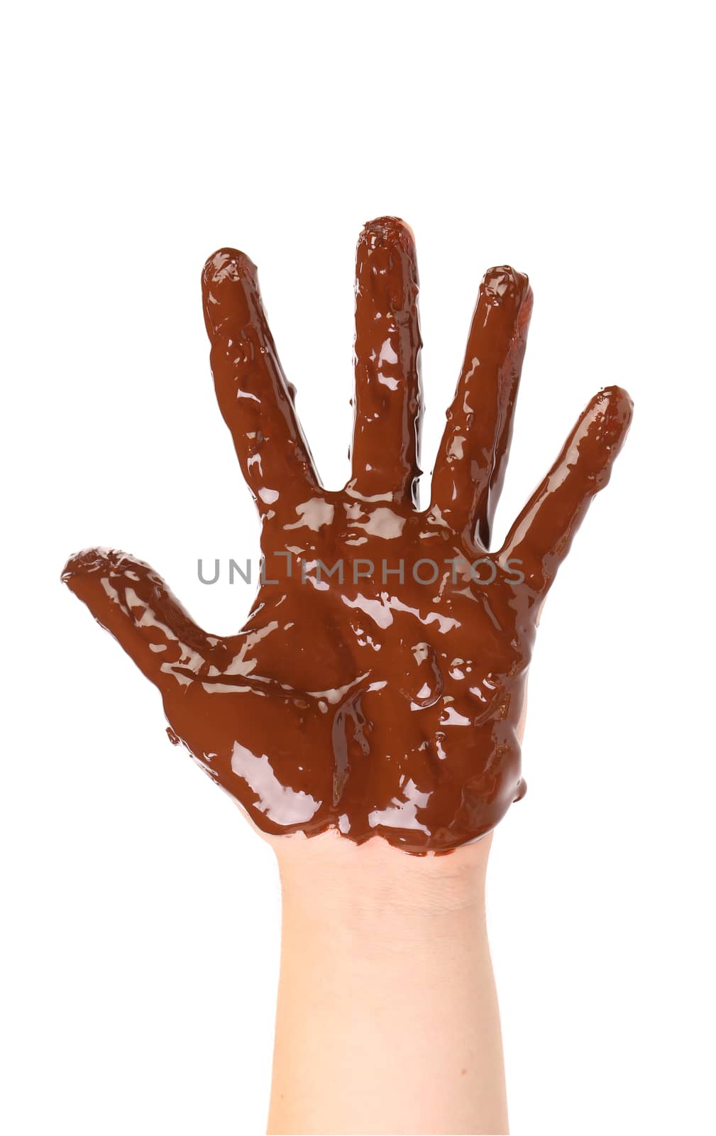 Children's hand stained with thick chocolate frosting. White background.