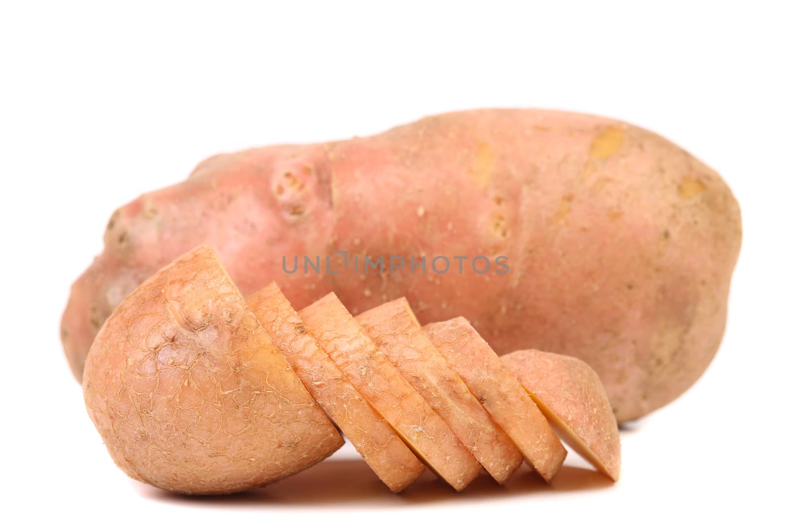 Potato and slices isolated on a white background.
