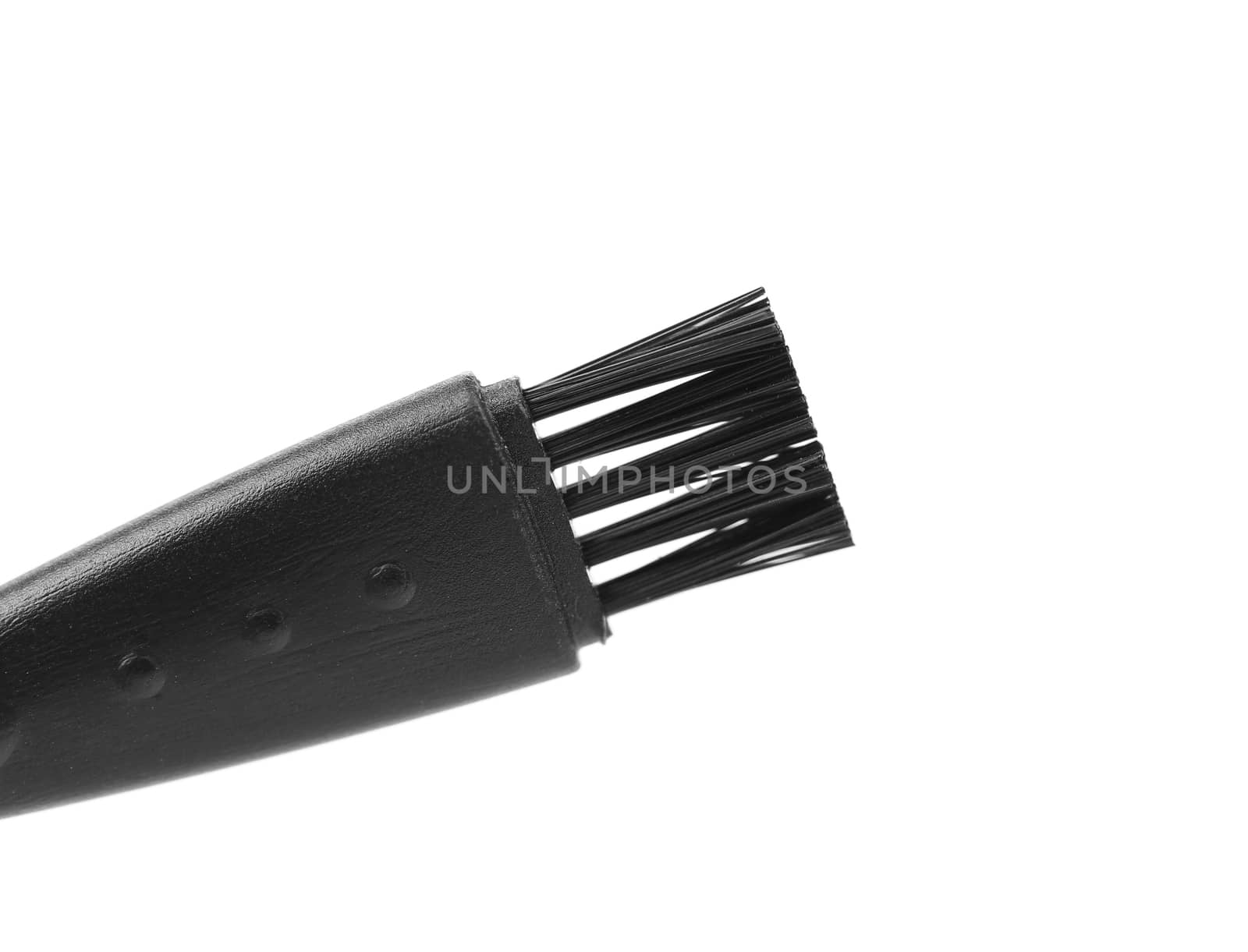 Black plastic brush. Close up. White background.