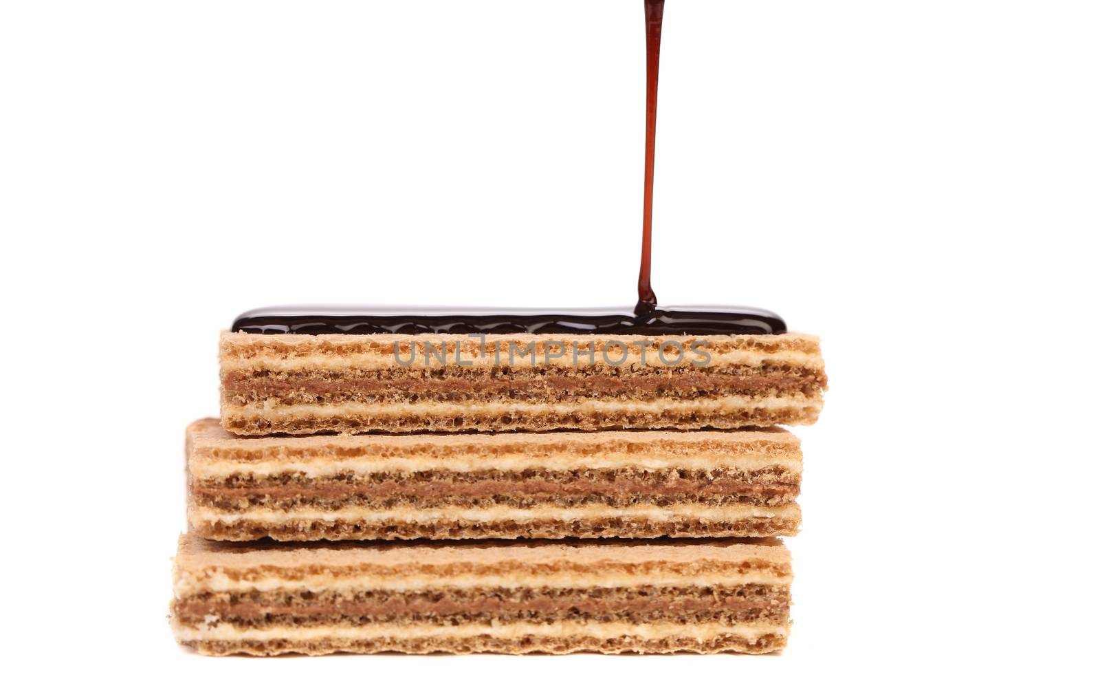 Coated stake wafers of chocolate. White background.