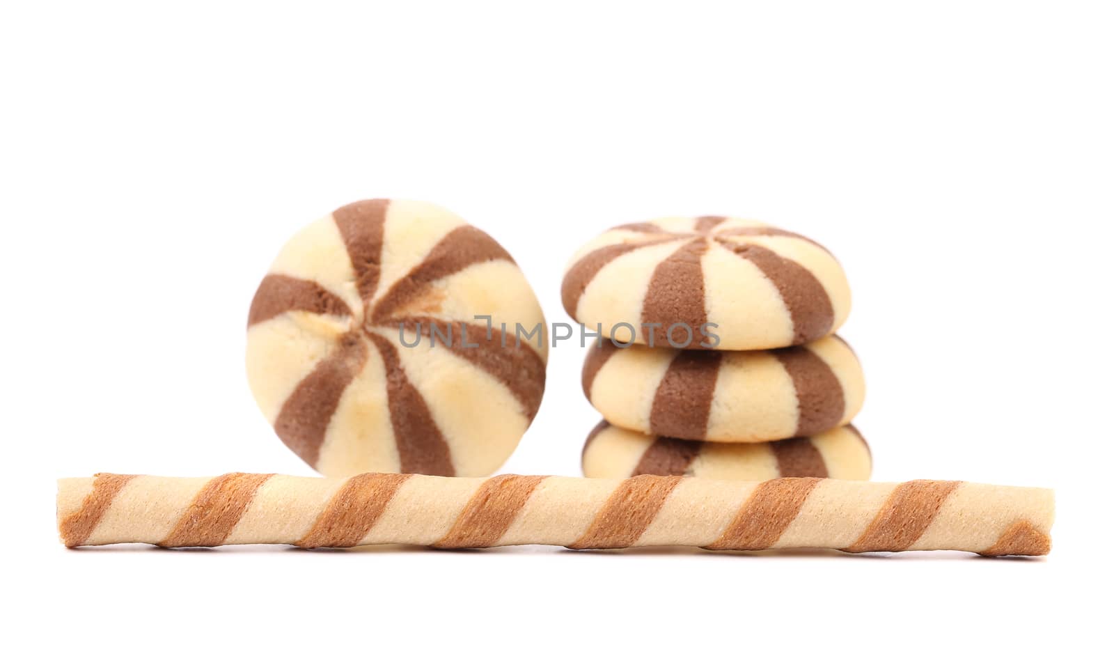 Striped chocolate wafer rolls and stake biscuits. White background.