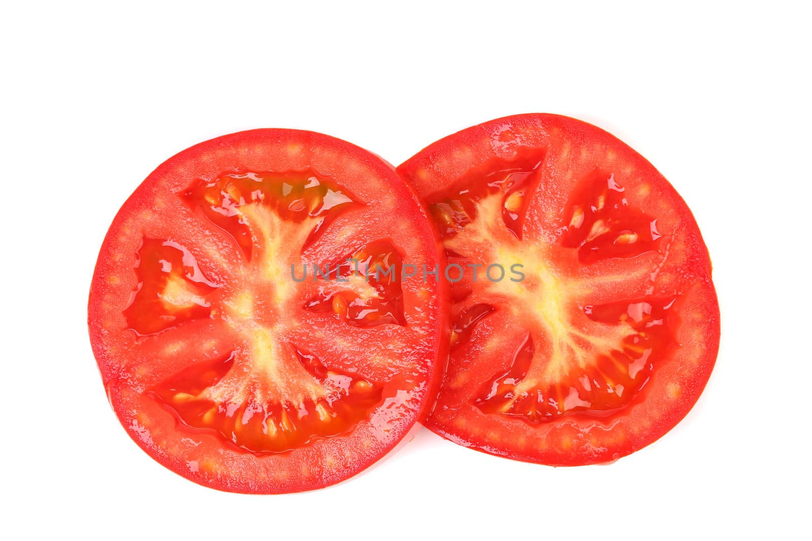 Slices of tomato isolated on white background