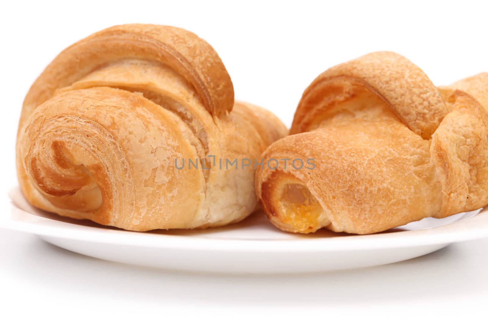 Group of Croissants on Saucer Isolated on White Background