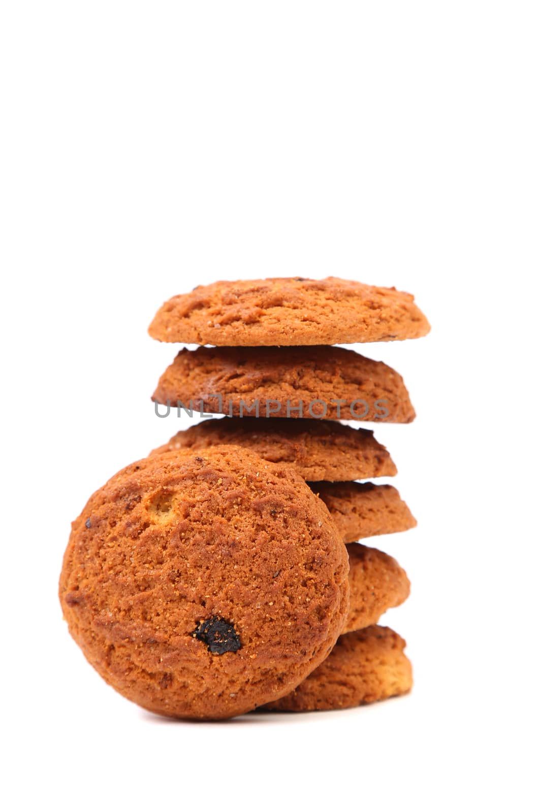Stack of outmeal cookies with raisins. White background.