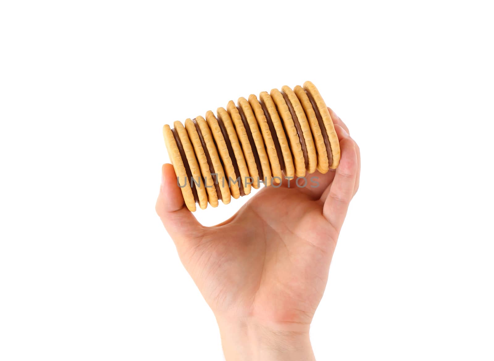 Hand holds closeup cookie biscuits with filling on white background