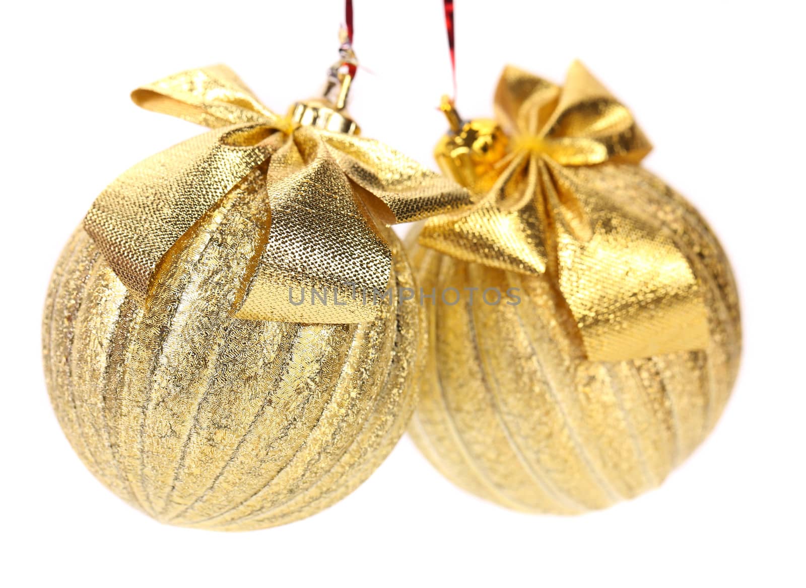 Two golden balls for the Christmas tree. White background.