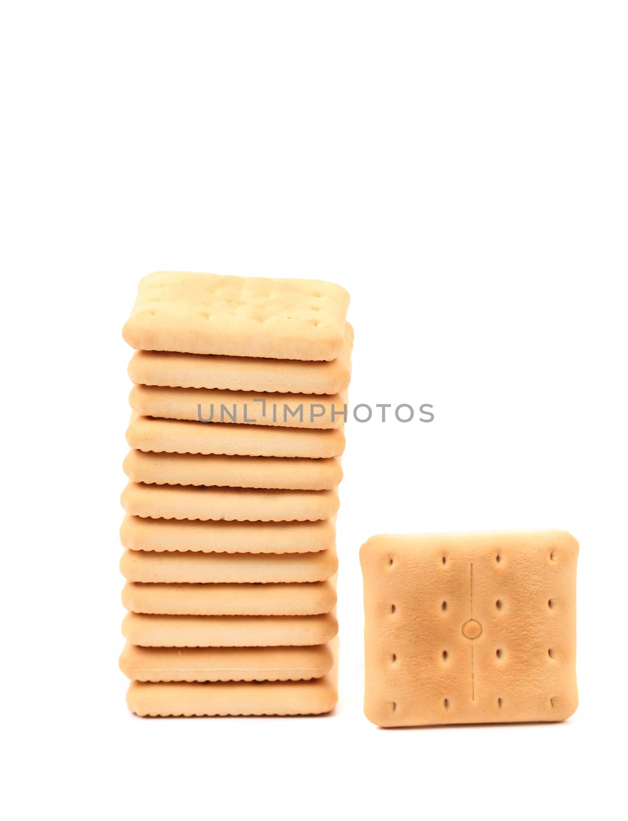 Stack of saltine soda crackers isolated on white