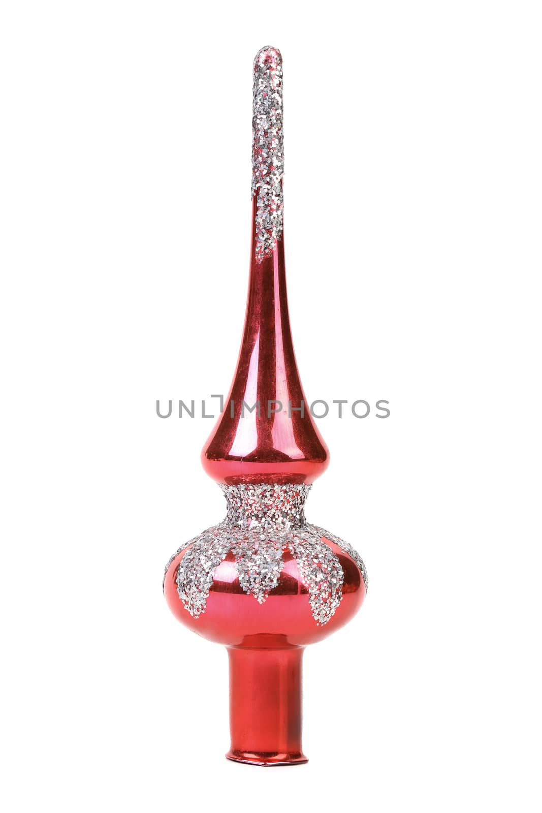 Toy adorns the top of the Christmas tree. White background.