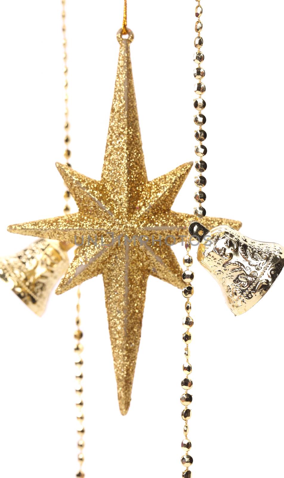 Golden christmas star and bells. White background.