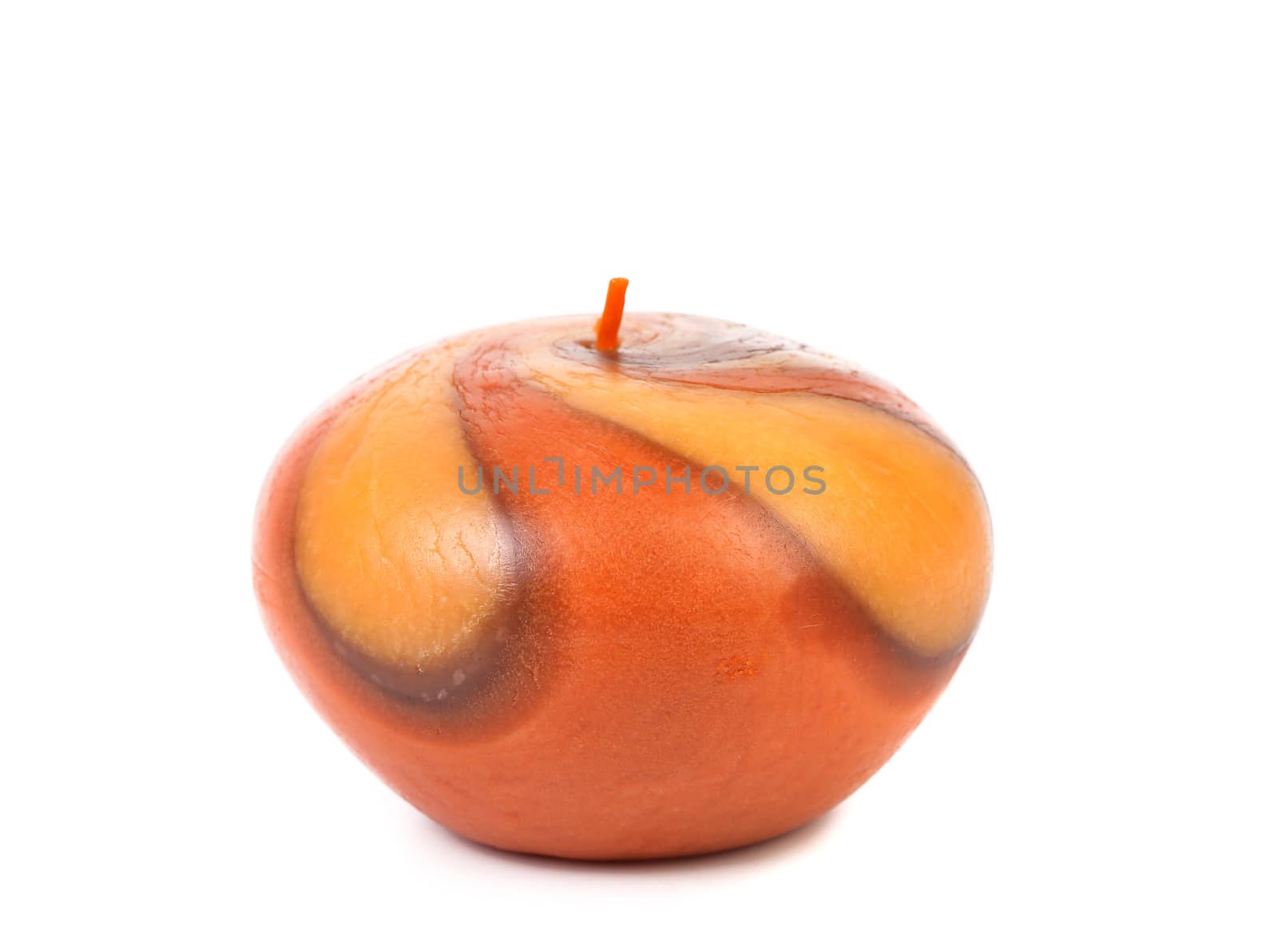 Decorative colourful candle. Close up. White background.