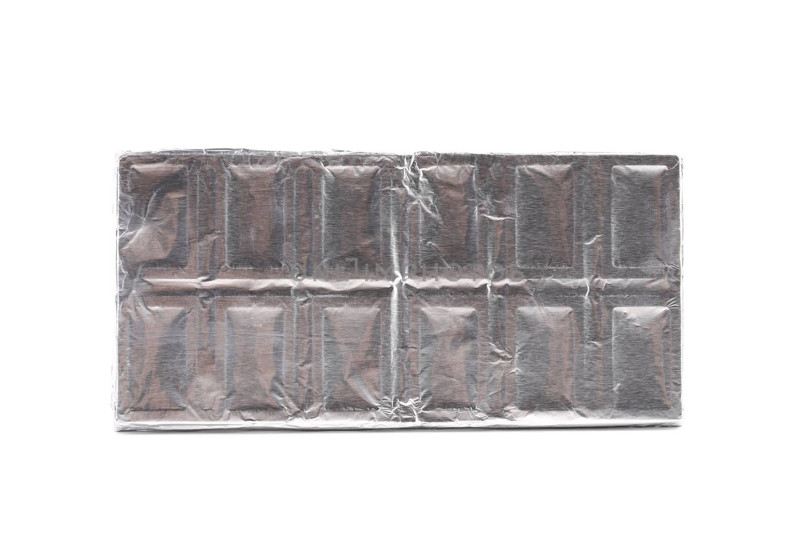 Chocolate bar wrapped in foil. White background.