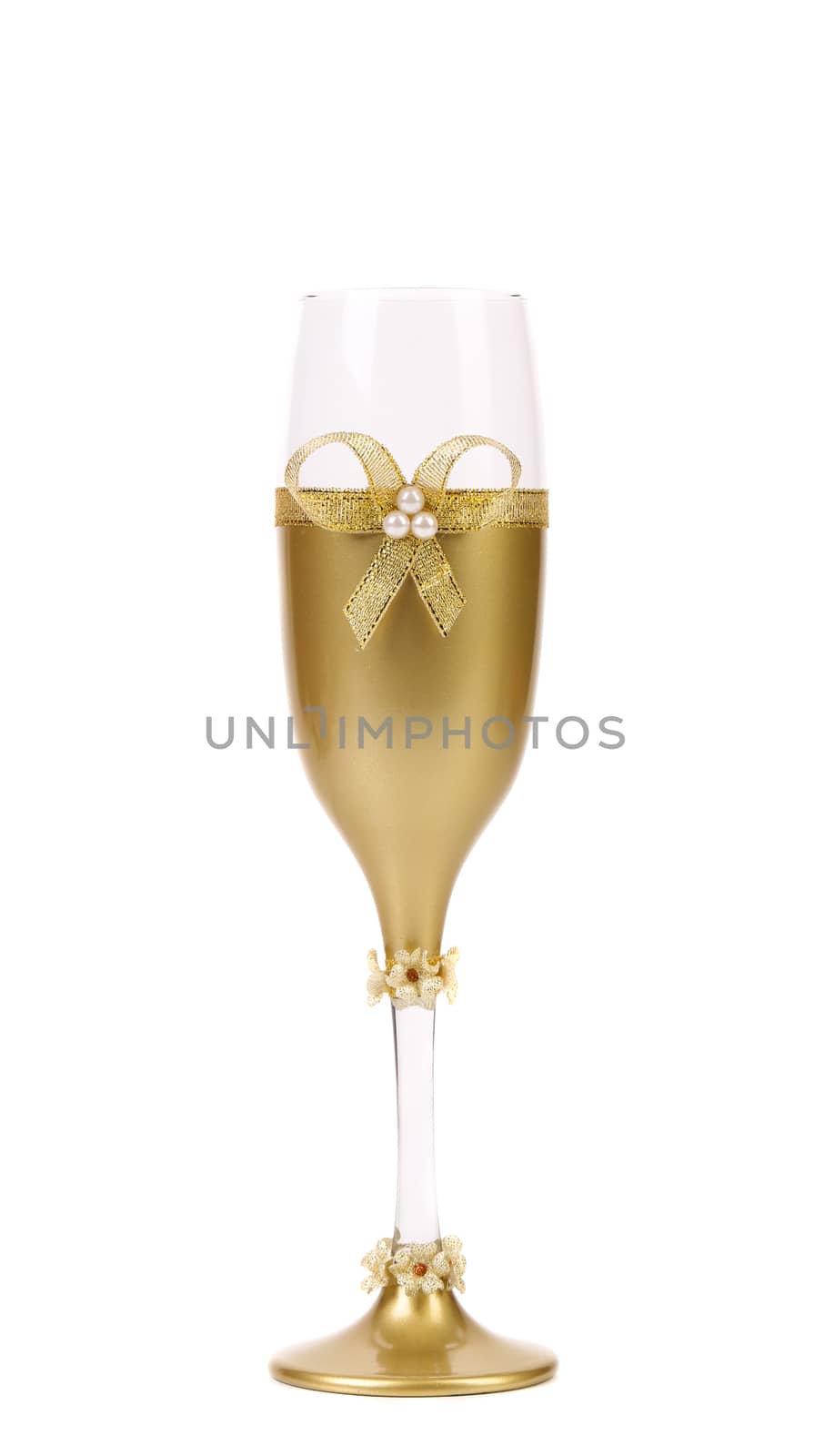 Decorated wedding golden glass wuth bow. White background.