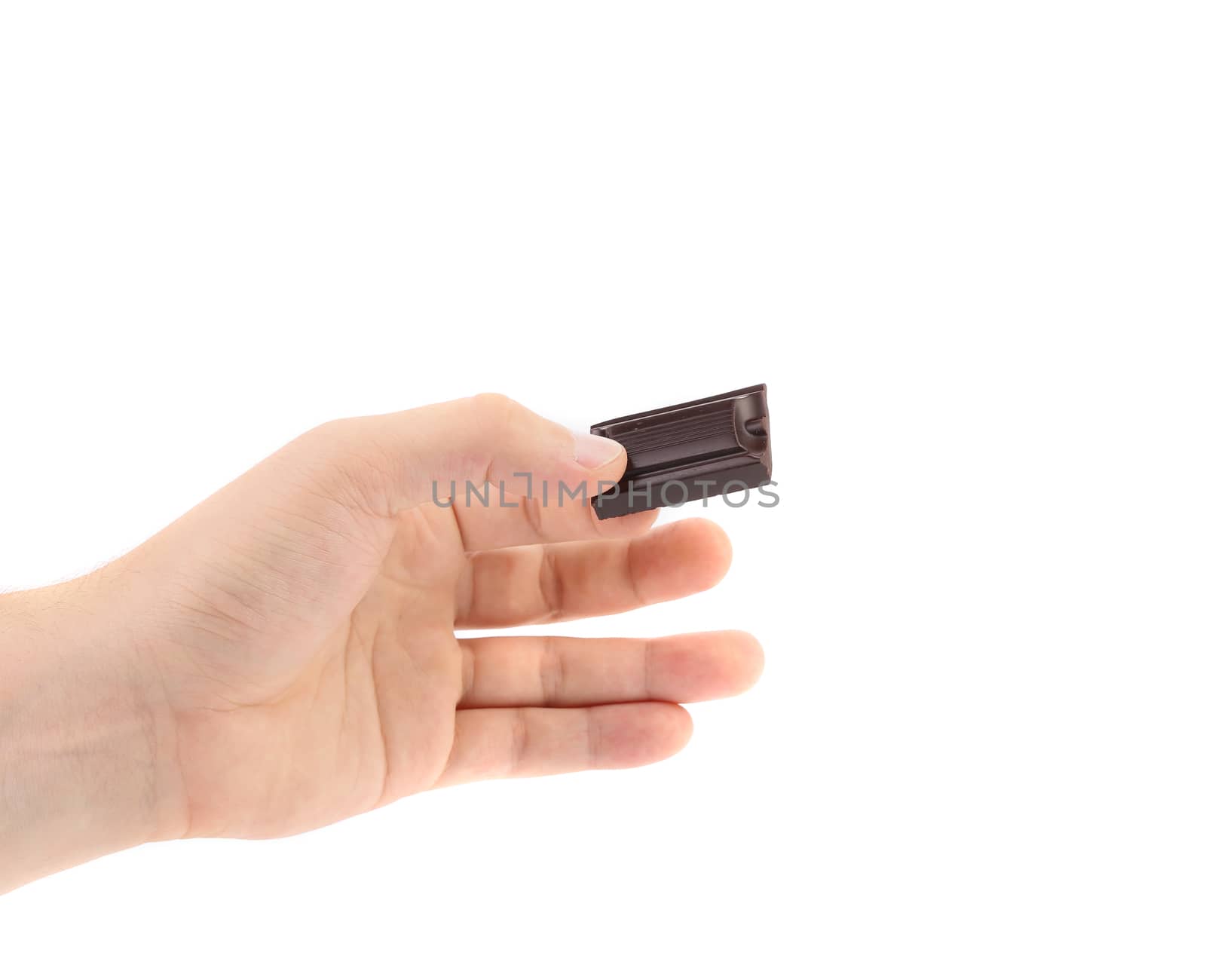 Hand holds chocolate bar. Isolated on a white background.
