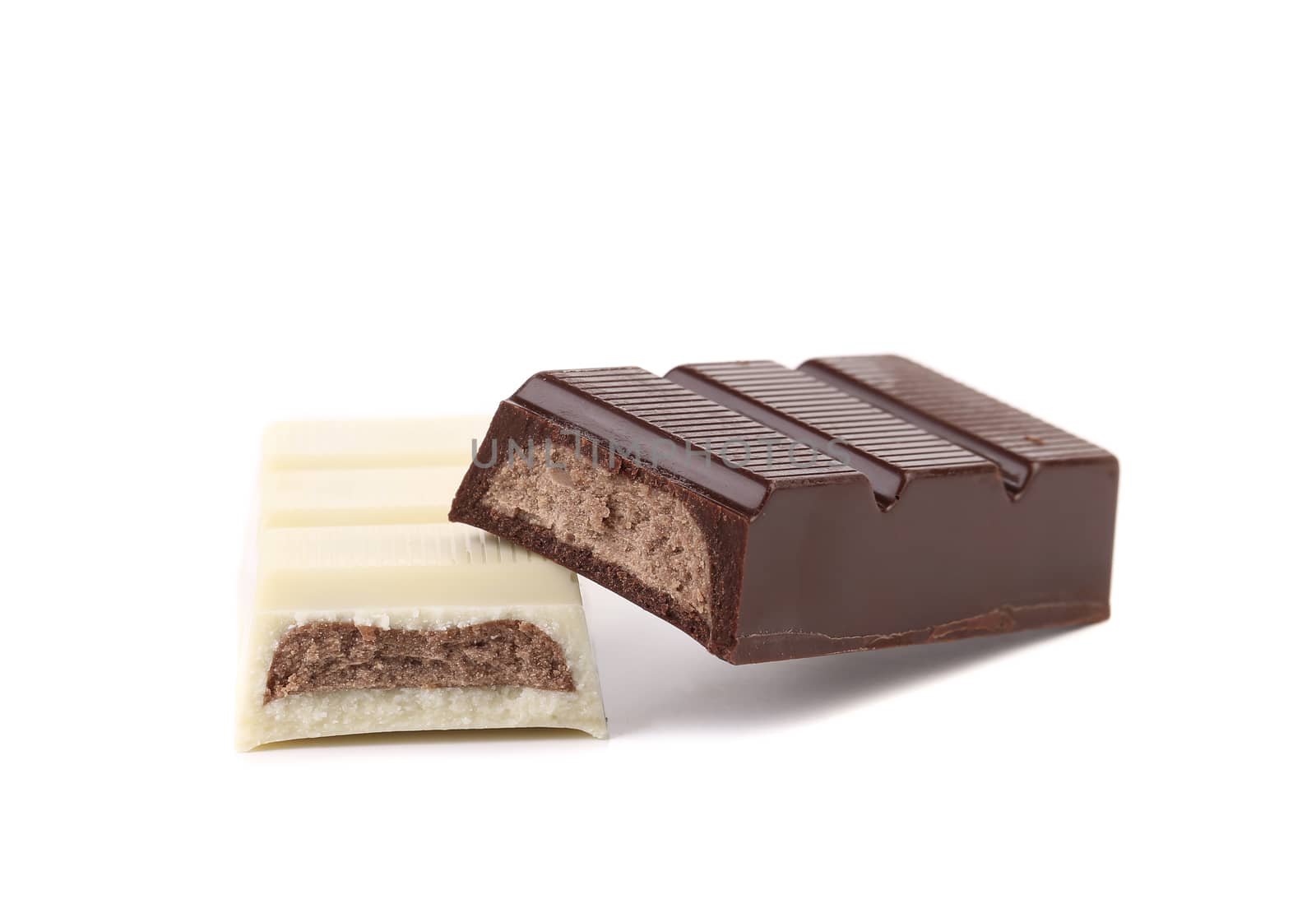 Black and white chocolate bar with filling. White background.