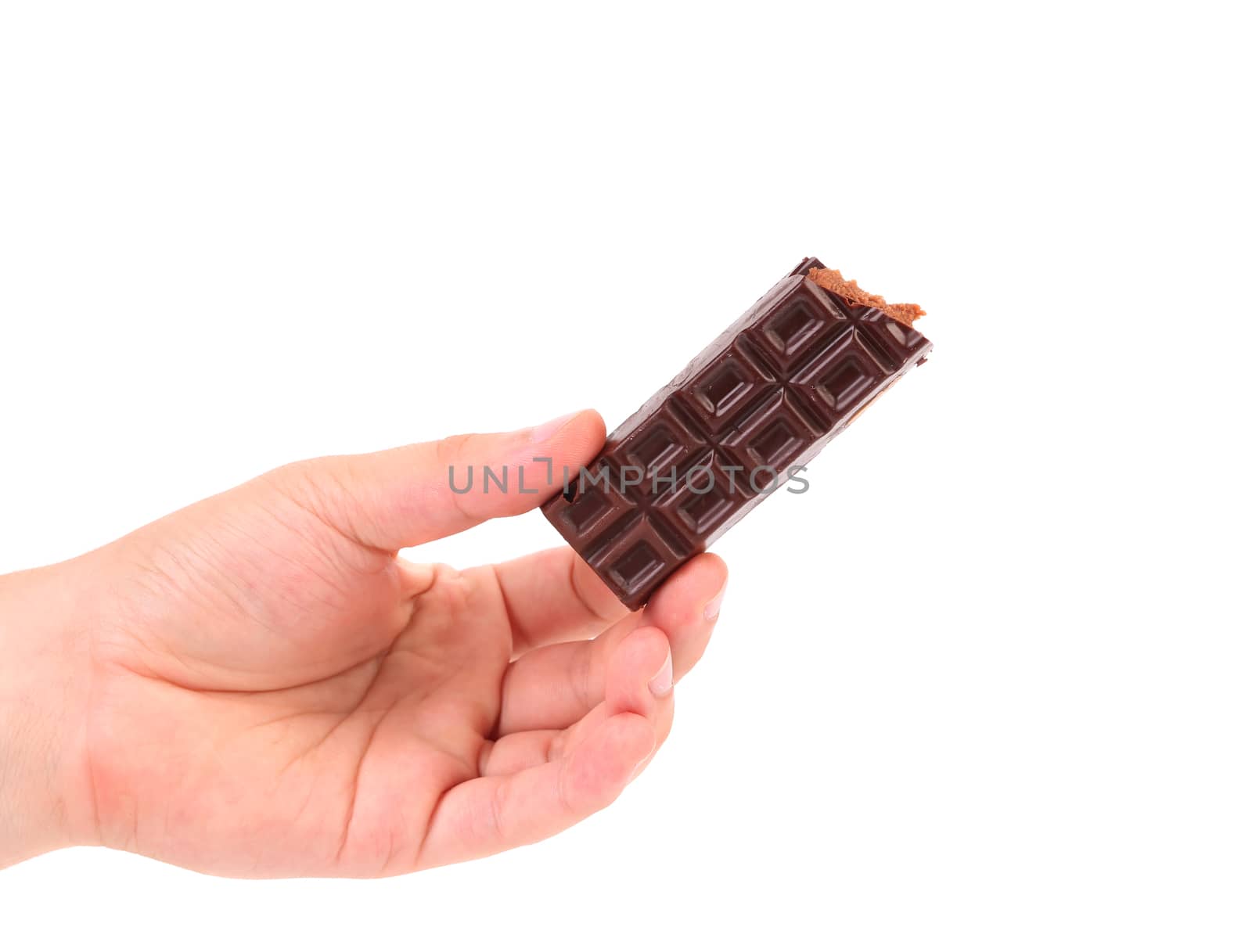 Hand holds chocolate bar with filling. Isolated on a white background.