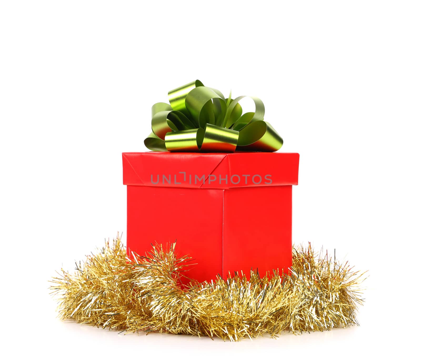 Red gift box with green-golden bow. White background.