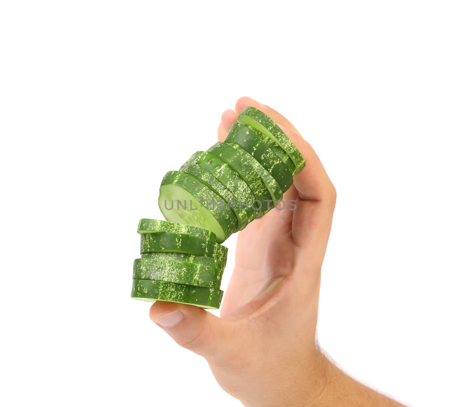 Hand holds stack juicy cucumber on a white background