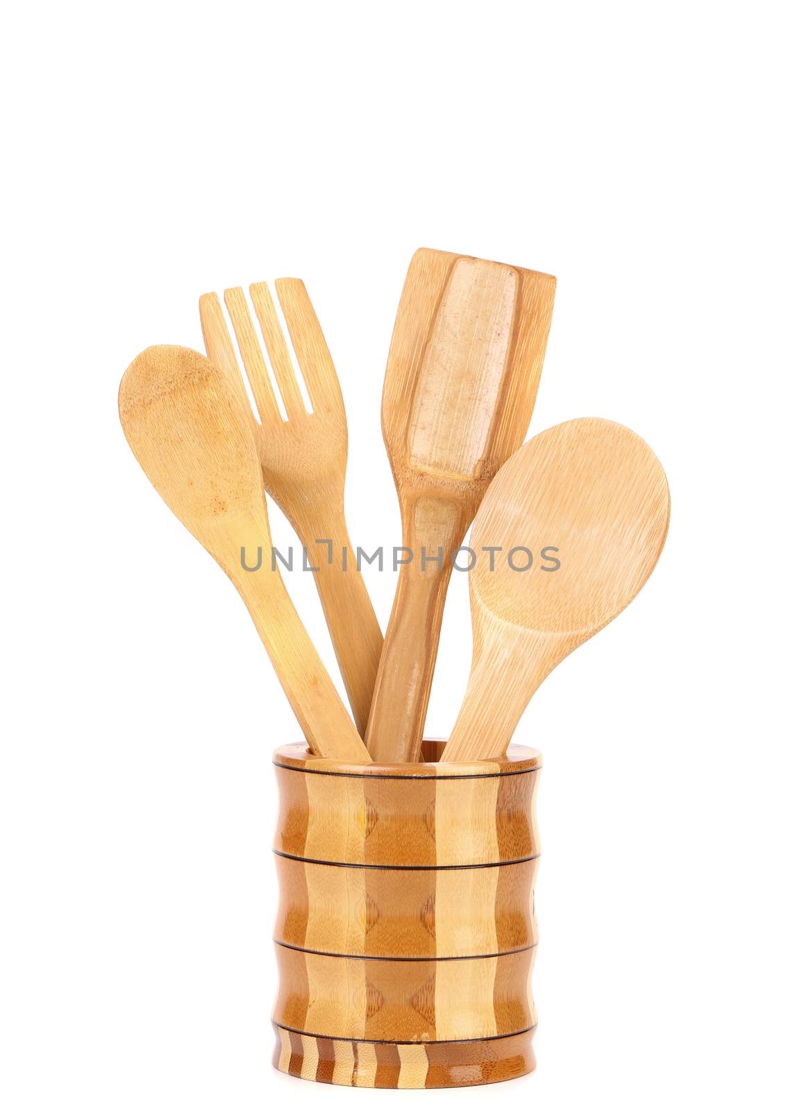 Wooden kitchen utensils in a jar. White background.