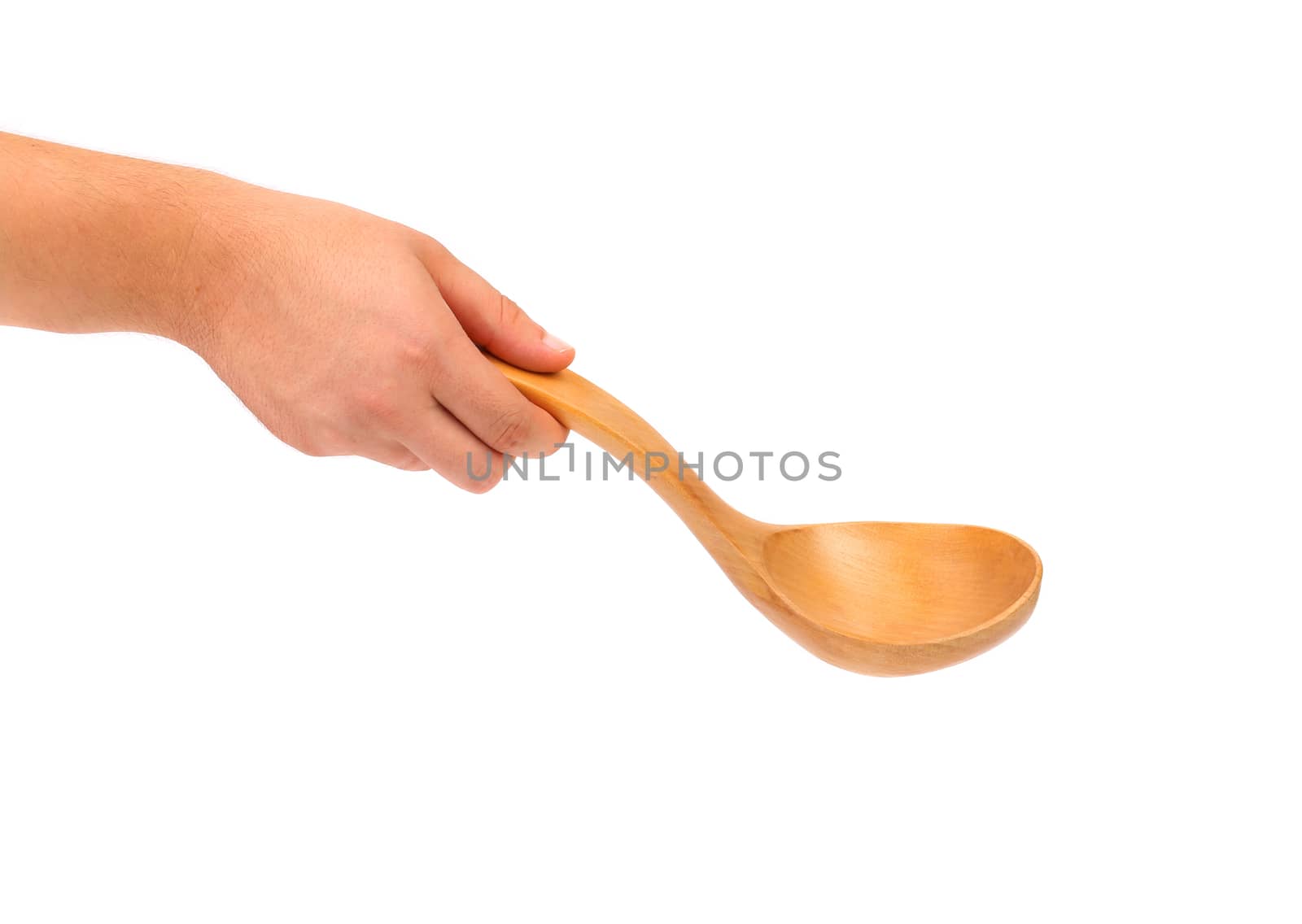 Hand holds wooden spoon. Isolated on a white background.