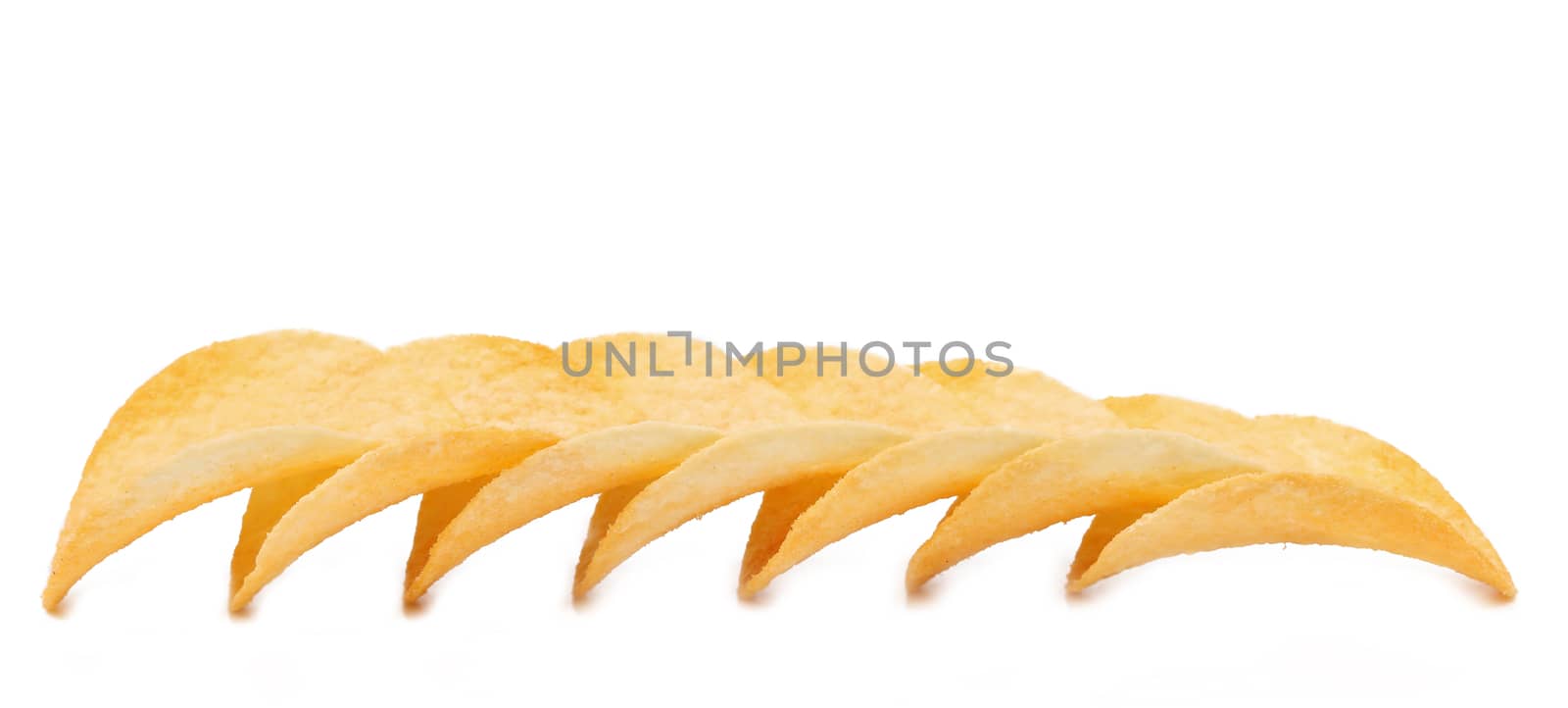 Row of potato chips on a white background