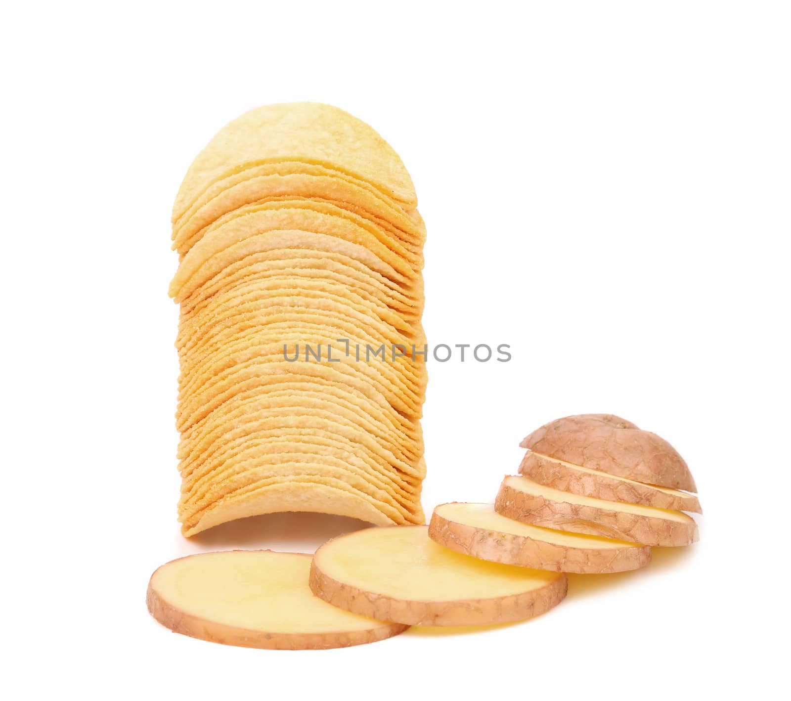 Potatoes slices and stack of chips. Isolated on a white background.