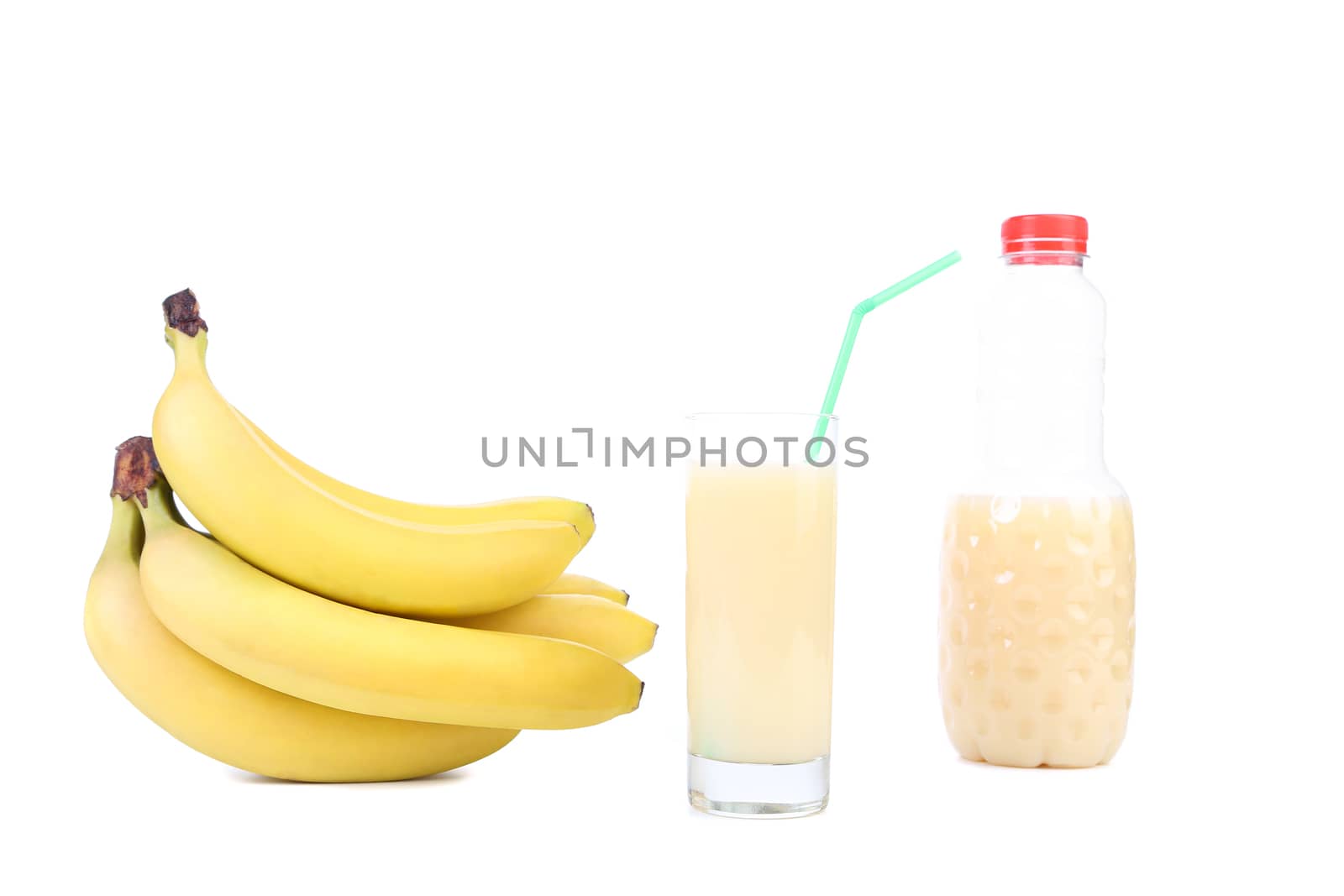 Glass and bottle of juice. Bananas. White background.