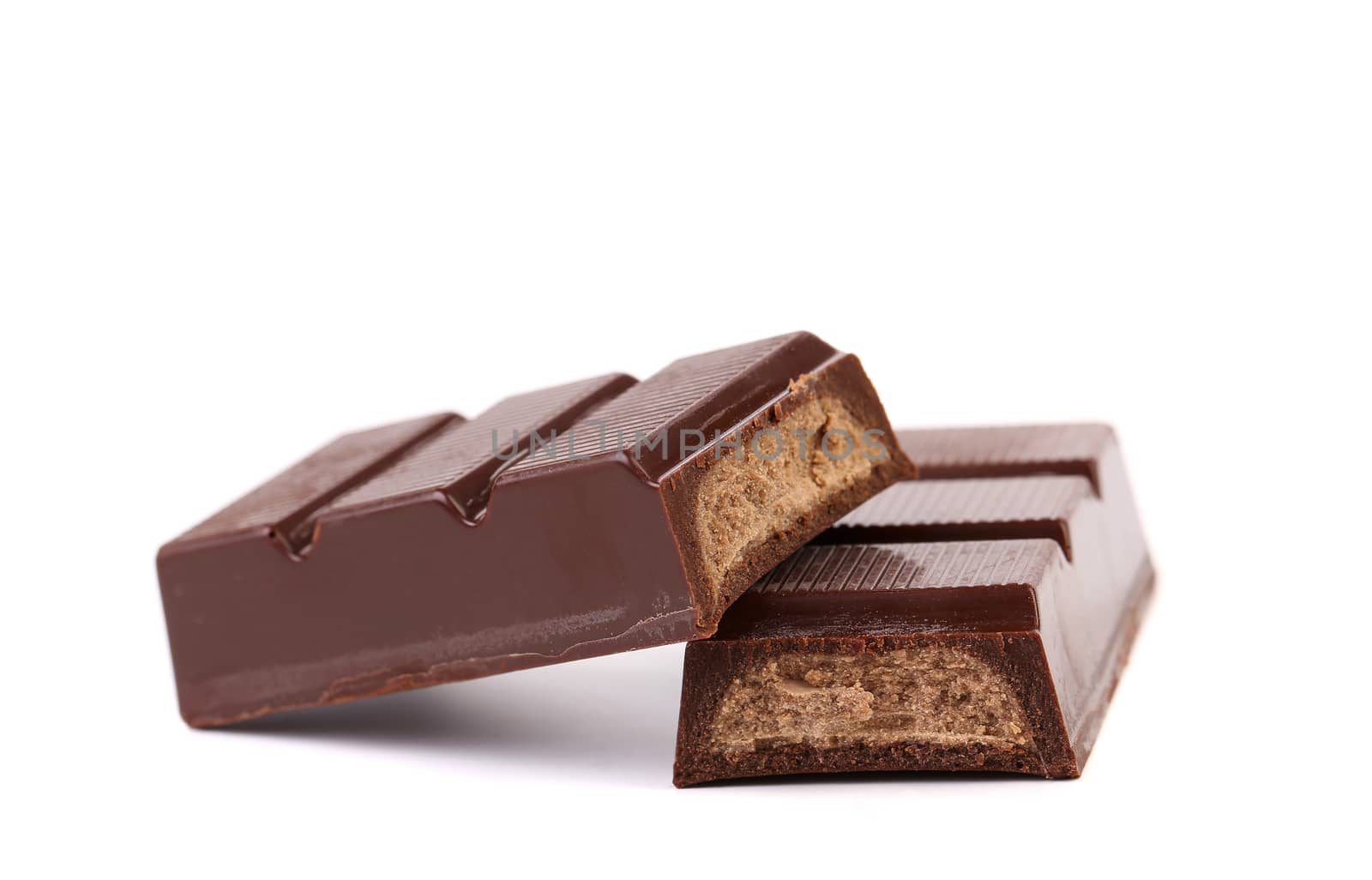 Splitted chocolate sticks with fillihg. White background.