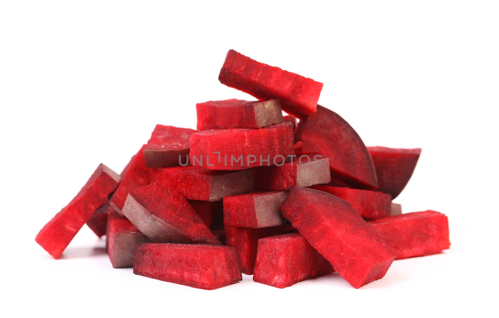 Fresh segments of a beet on a white background
