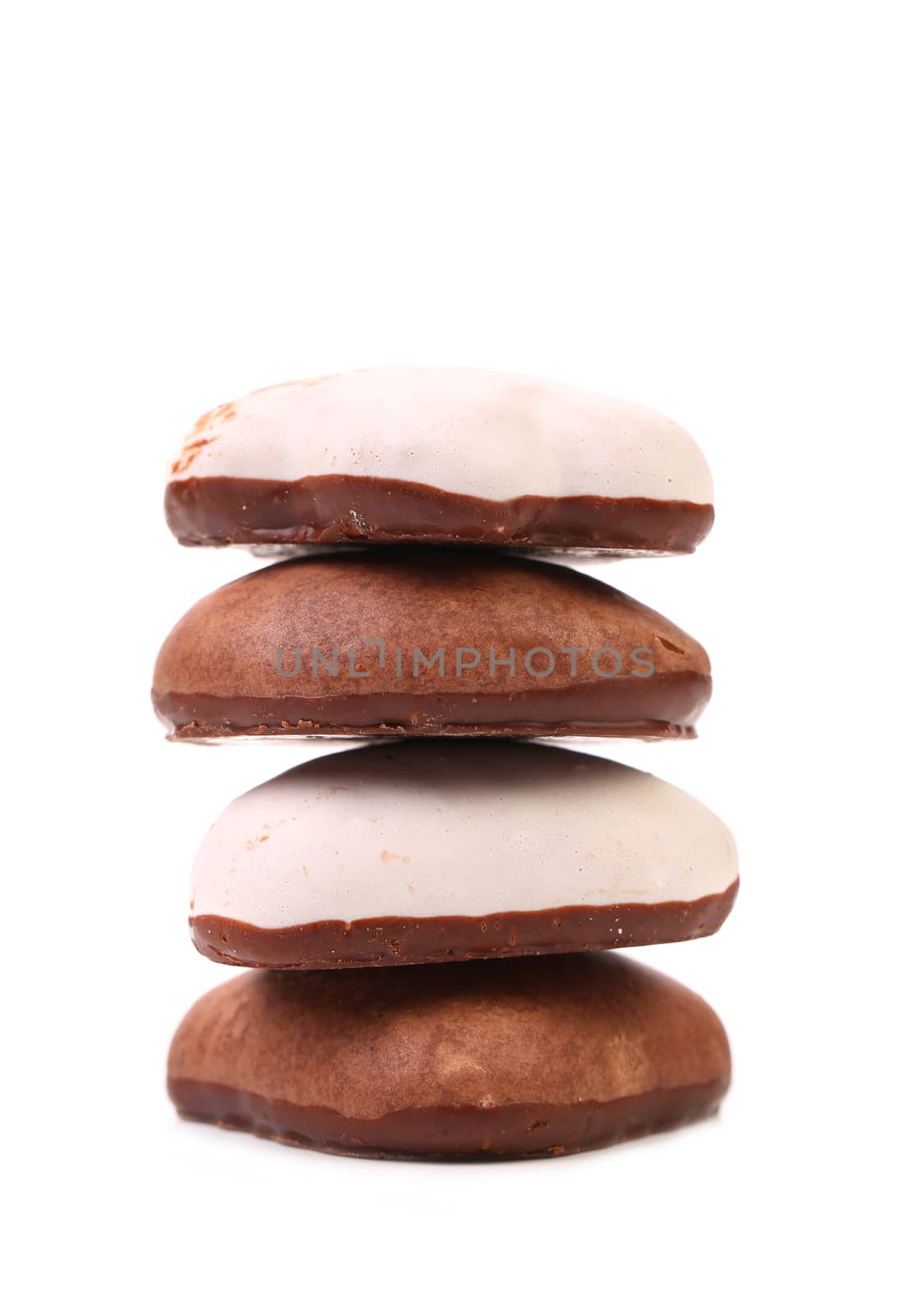 Stack of chocolate meringues.   Isolated on a white background.