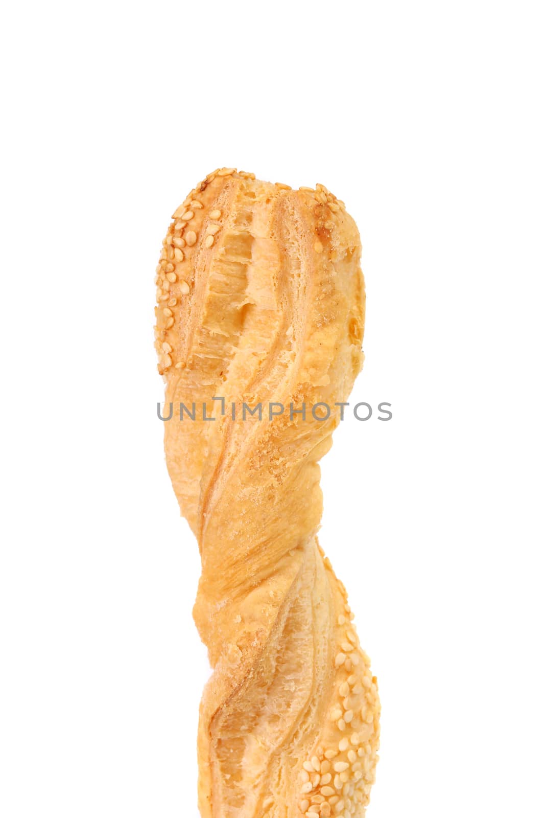 Just baked crunchy puff pastry with sesame. White background.