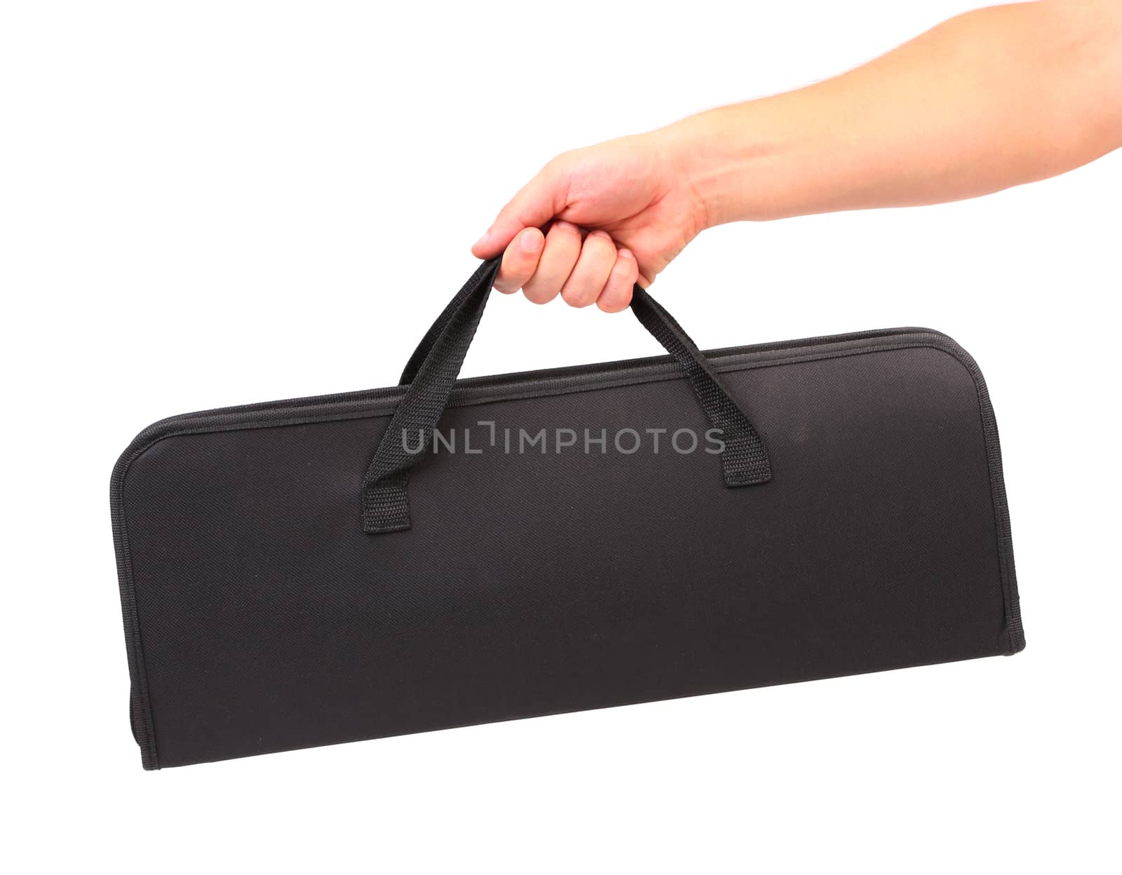 Hand holds black set of skewers for barbecue. White background.
