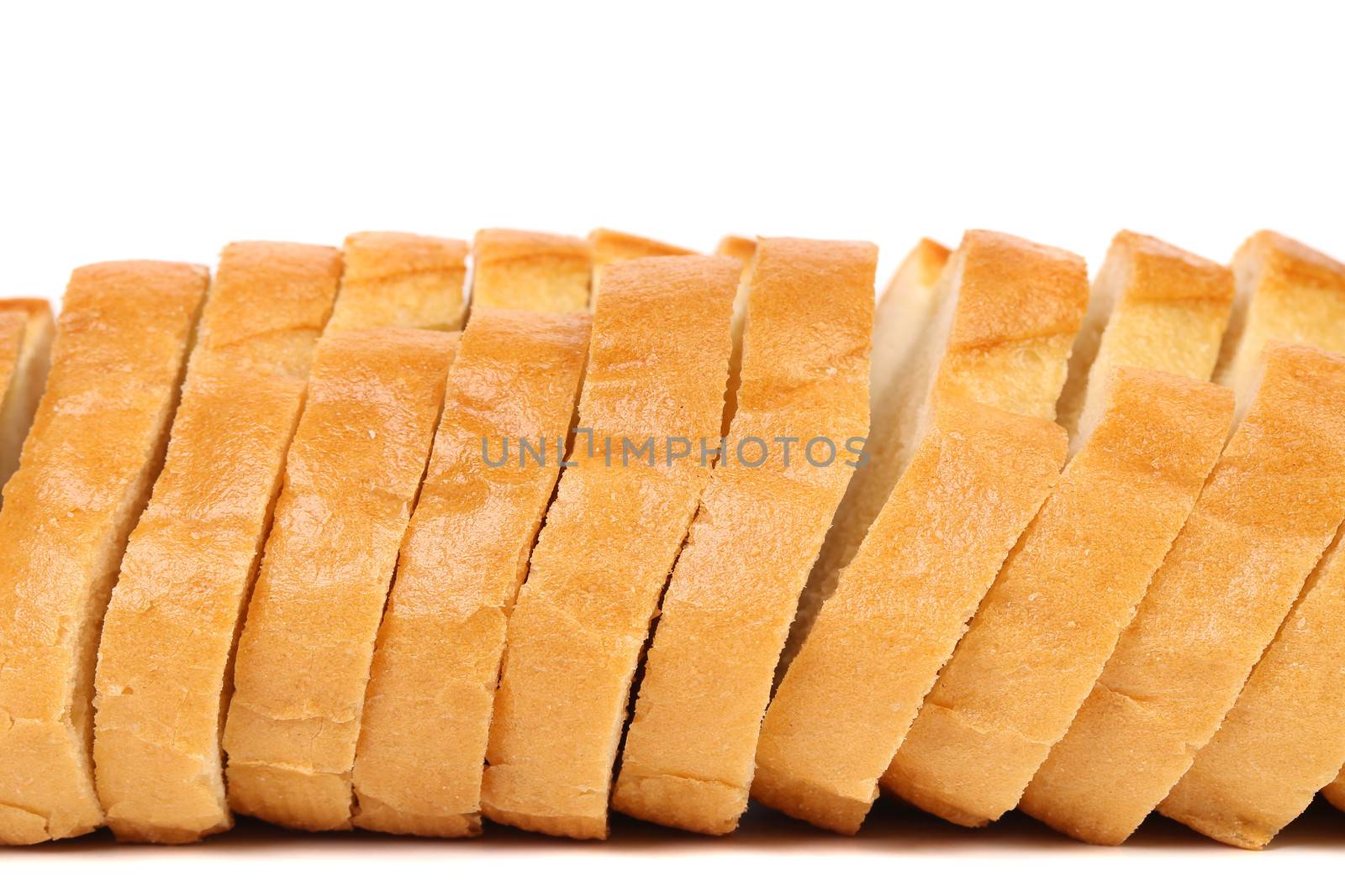 Close up of sliced long loaf. White background.