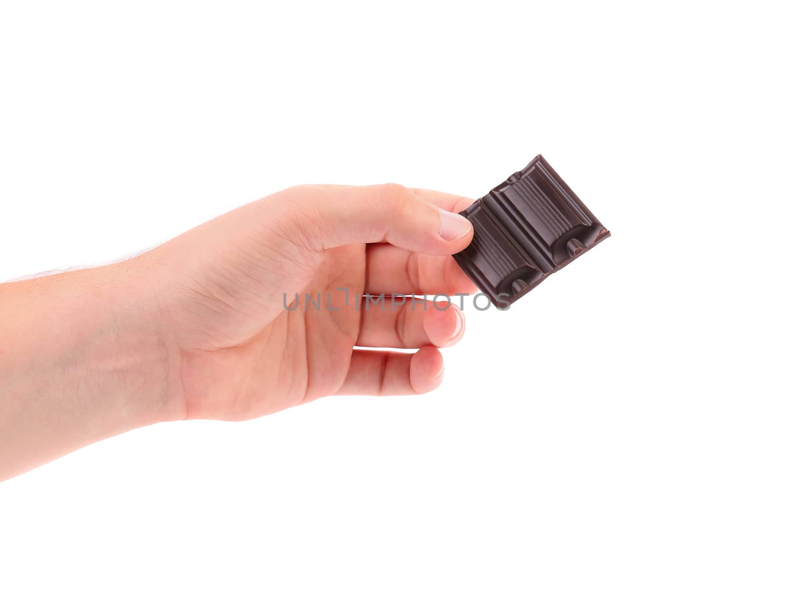 Hand holds chocolate bar. Isolated on a white background.