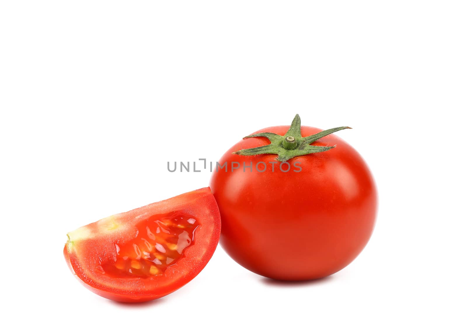 Tomato and segment isolated on a white background.