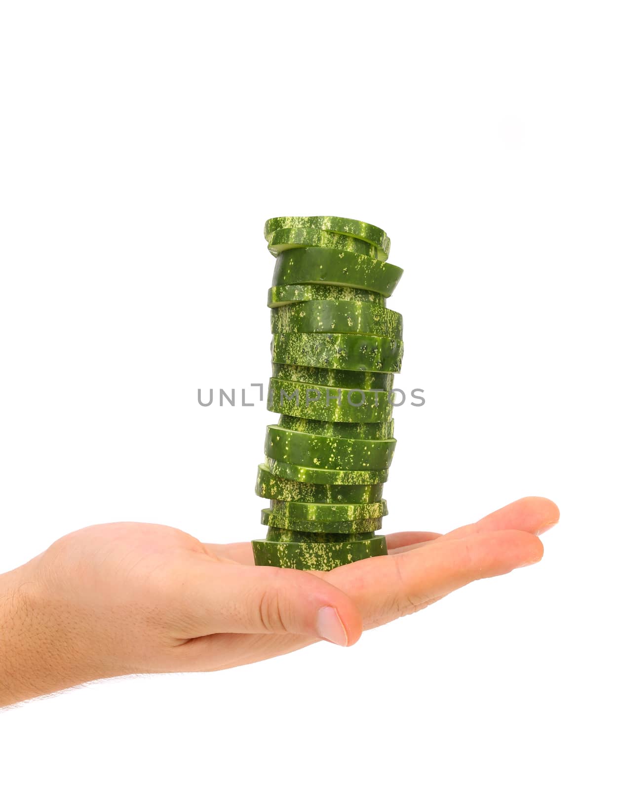 Hand holds stack juicy cucumber on a white background