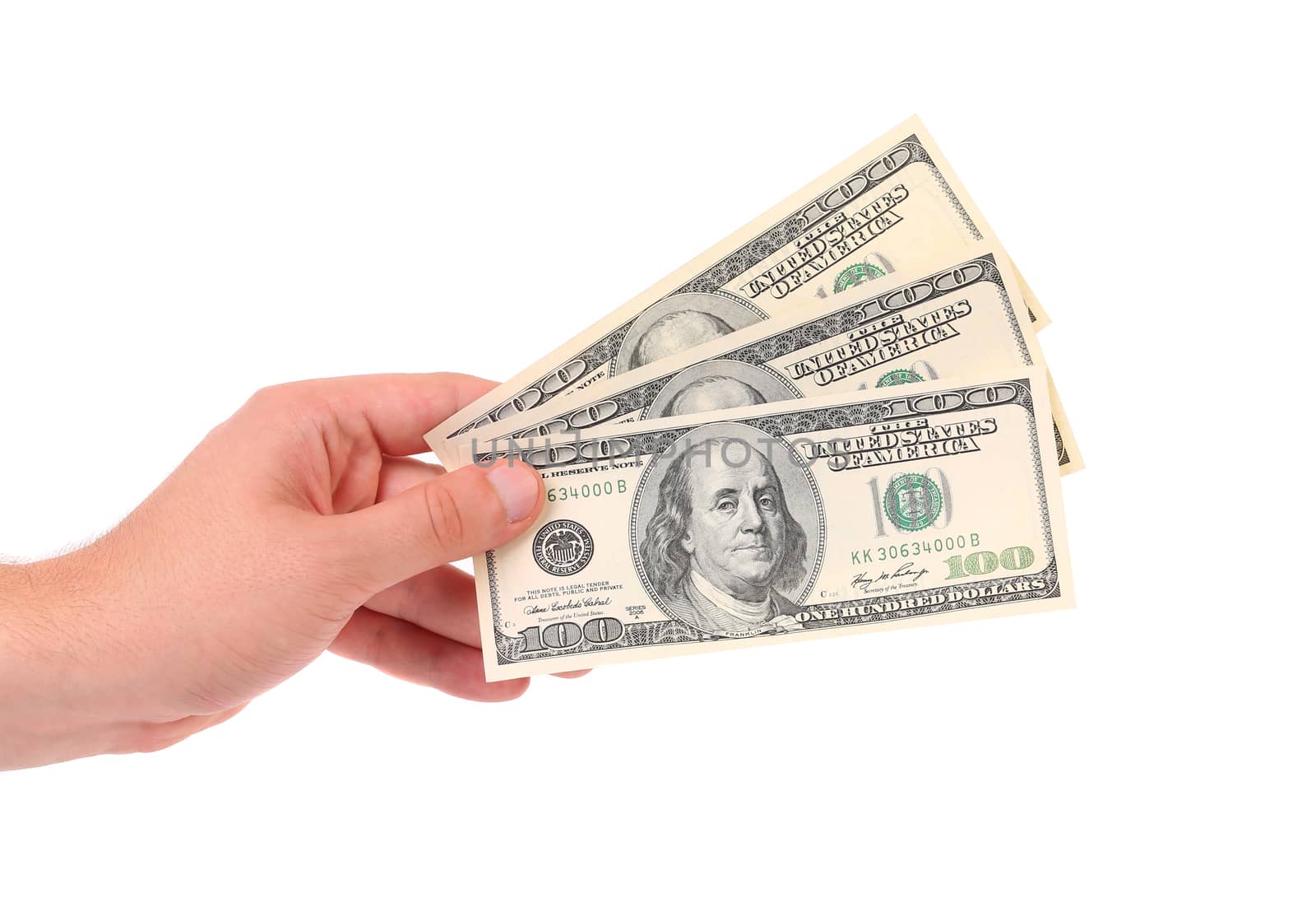 Hand holds american Dollar-bills. Isolated on a white background.