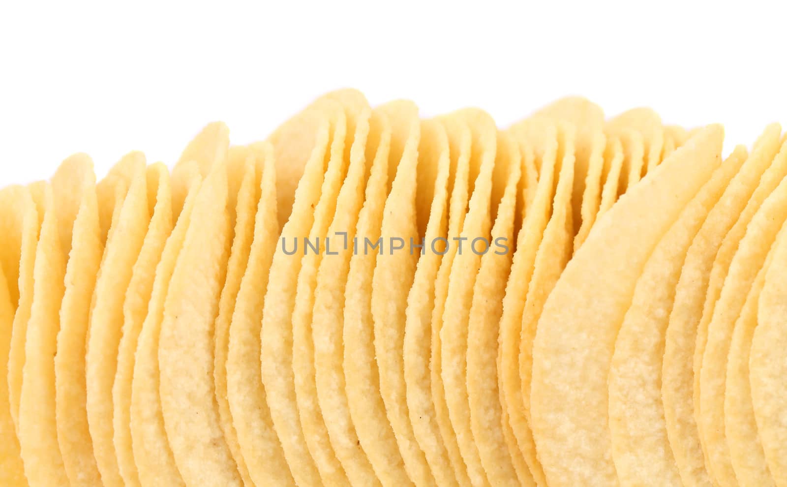 Background of potato chips. Close up. White background.